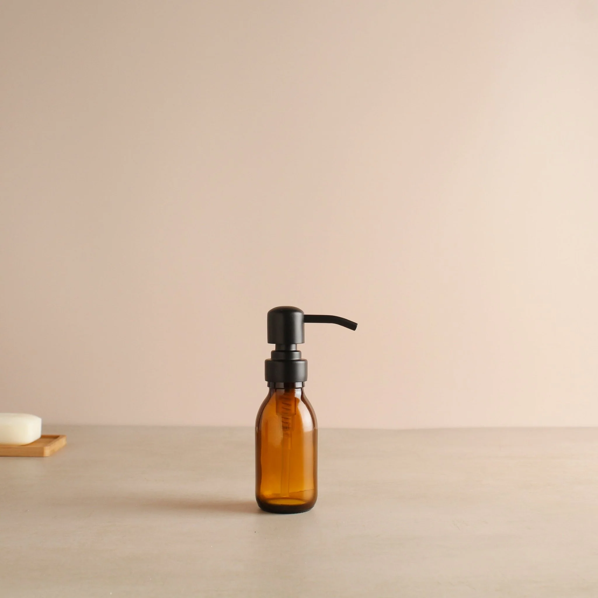 Amber Glass Dispenser Bottle With Matte Black Pump - Image 6