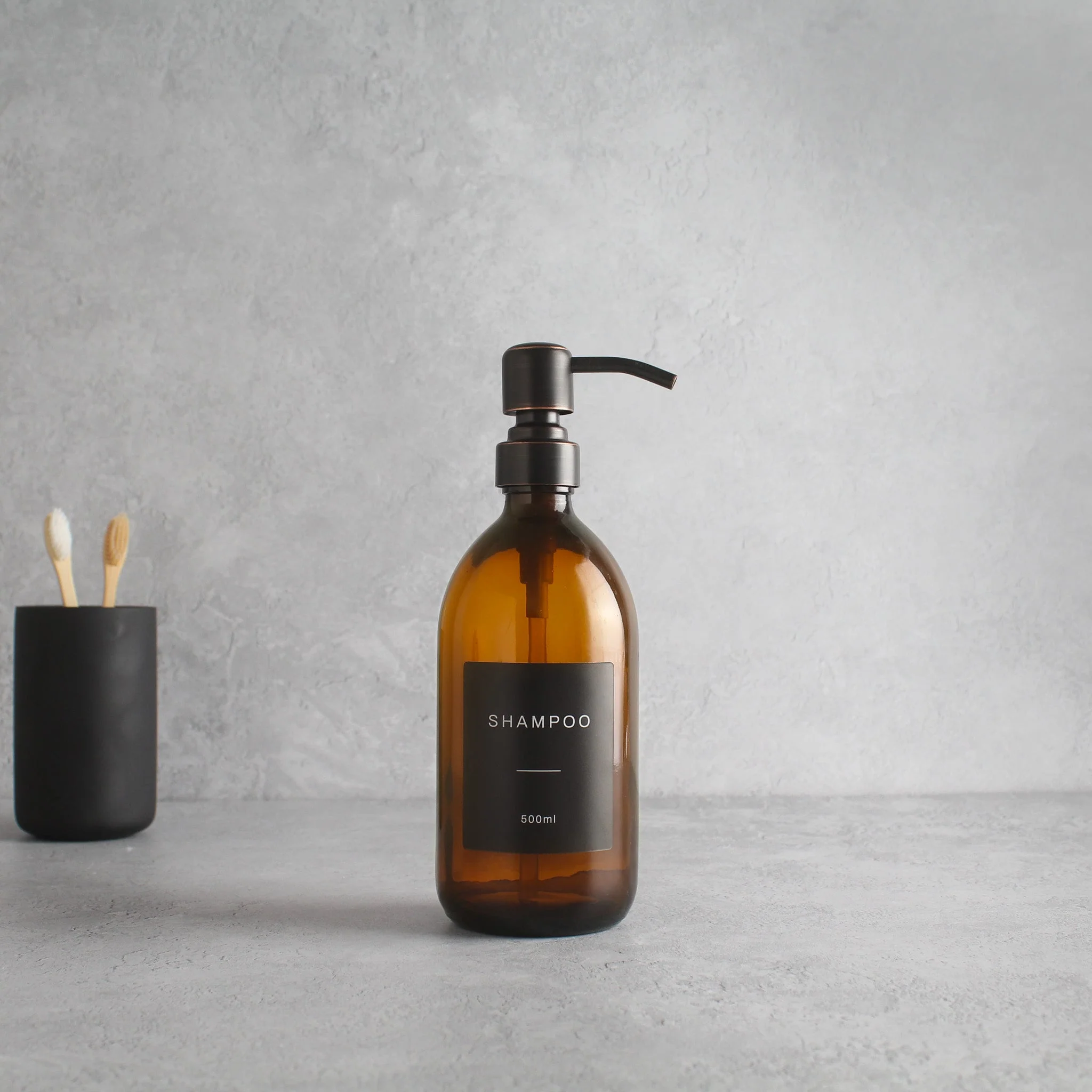 Labelled Amber Glass Dispenser Bottle With Black/Copper Pump - Image 4