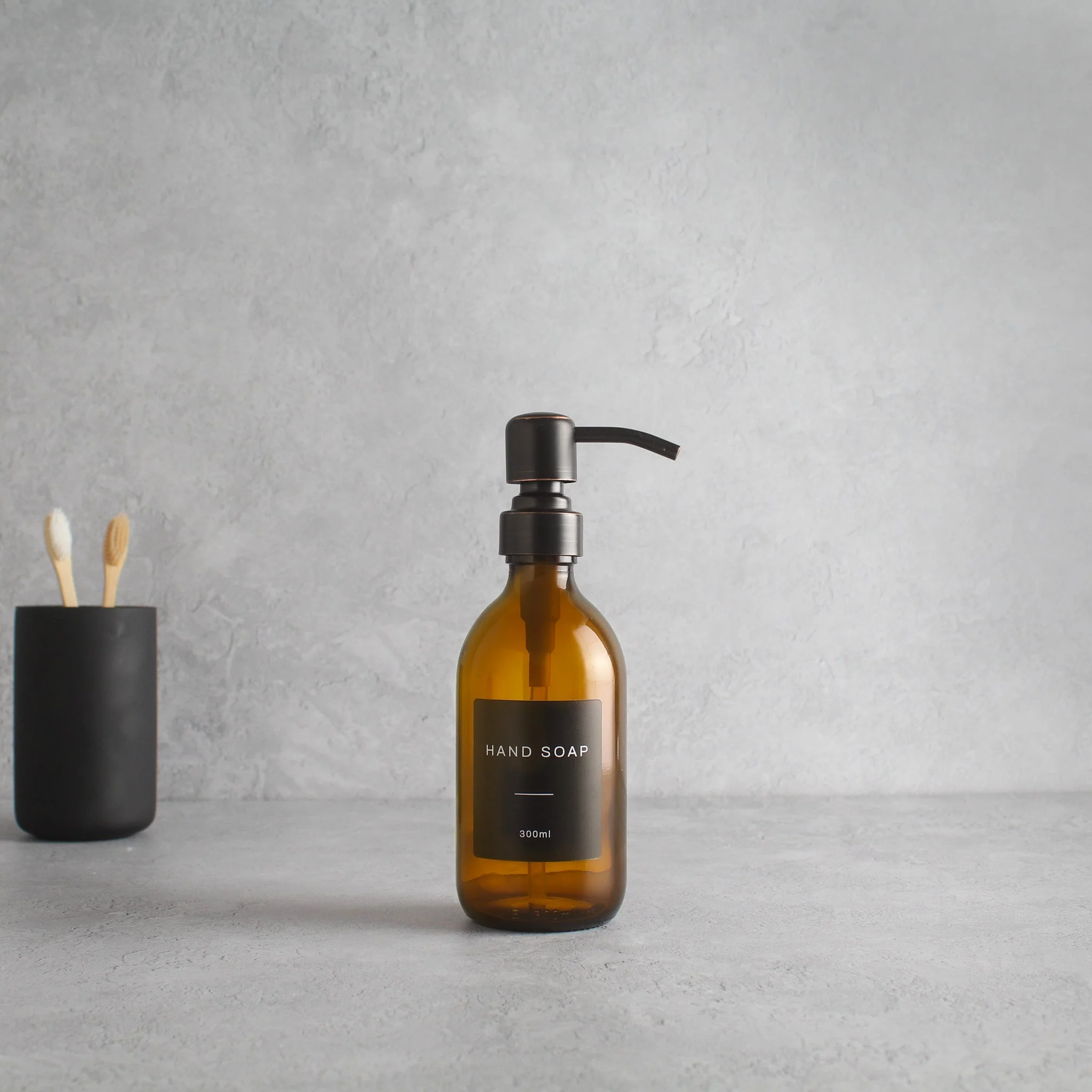 Labelled Amber Glass Dispenser Bottle With Black/Copper Pump - Image 5