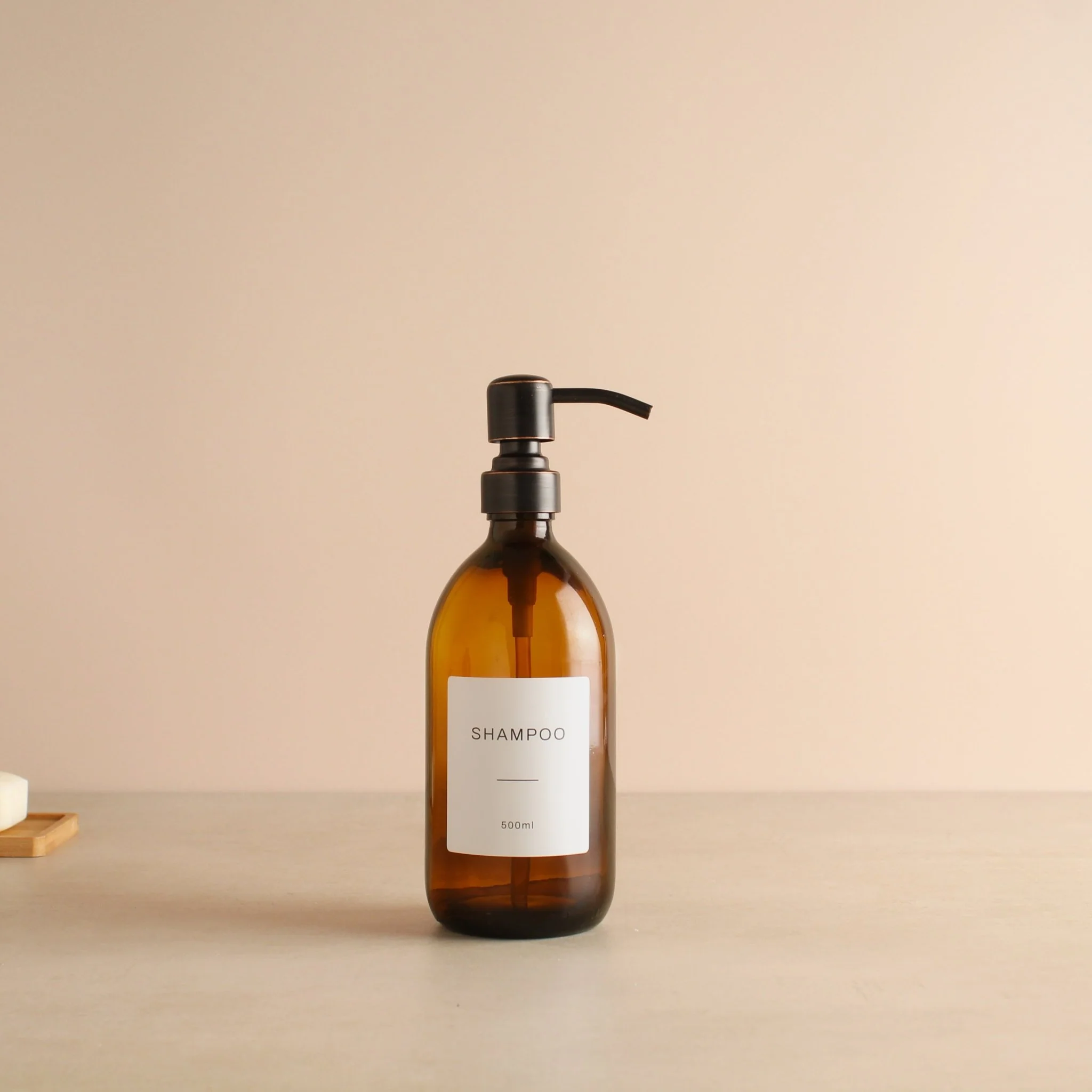 Labelled Amber Glass Dispenser Bottle With Black/Copper Pump - Image 4