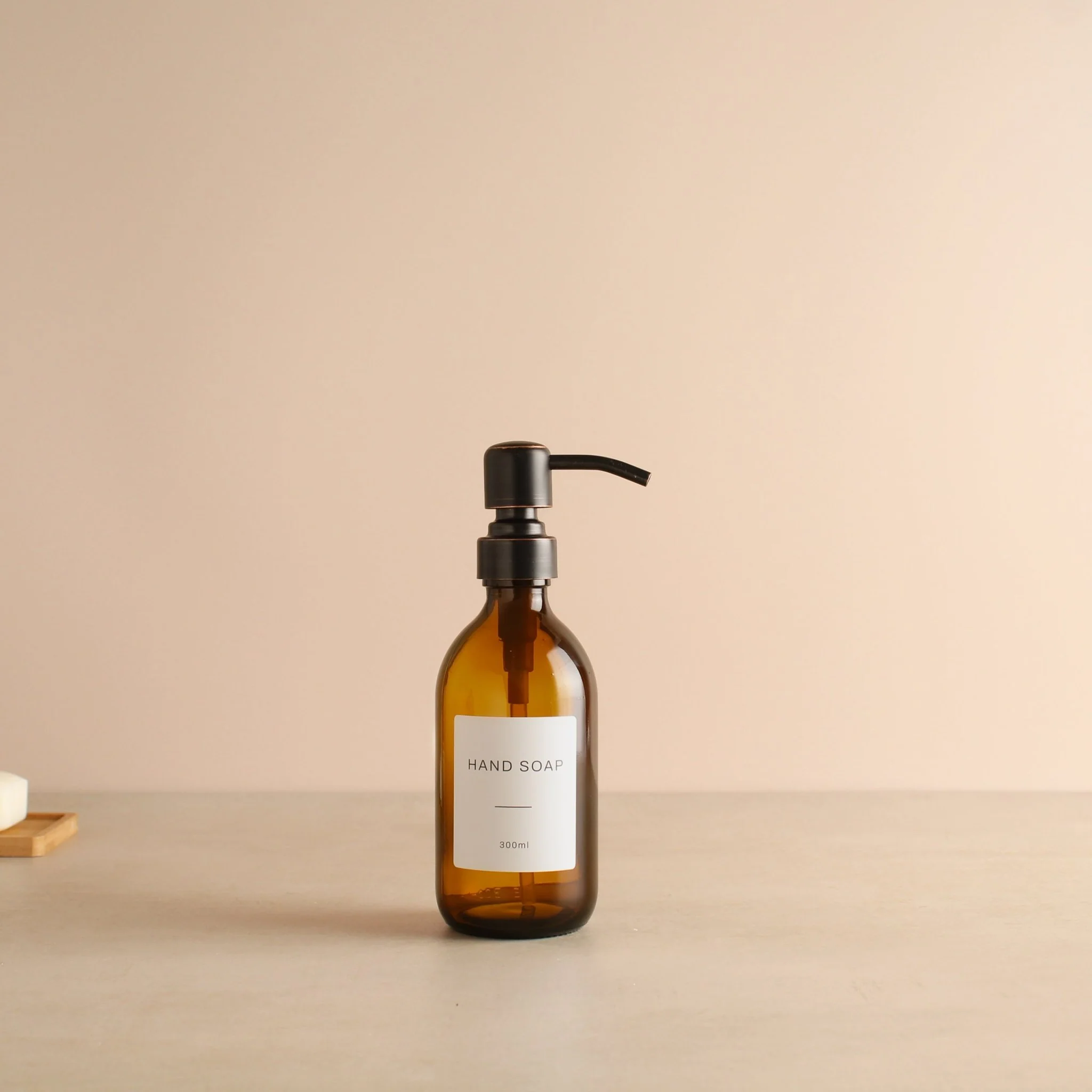 Labelled Amber Glass Dispenser Bottle With Black/Copper Pump - Image 5
