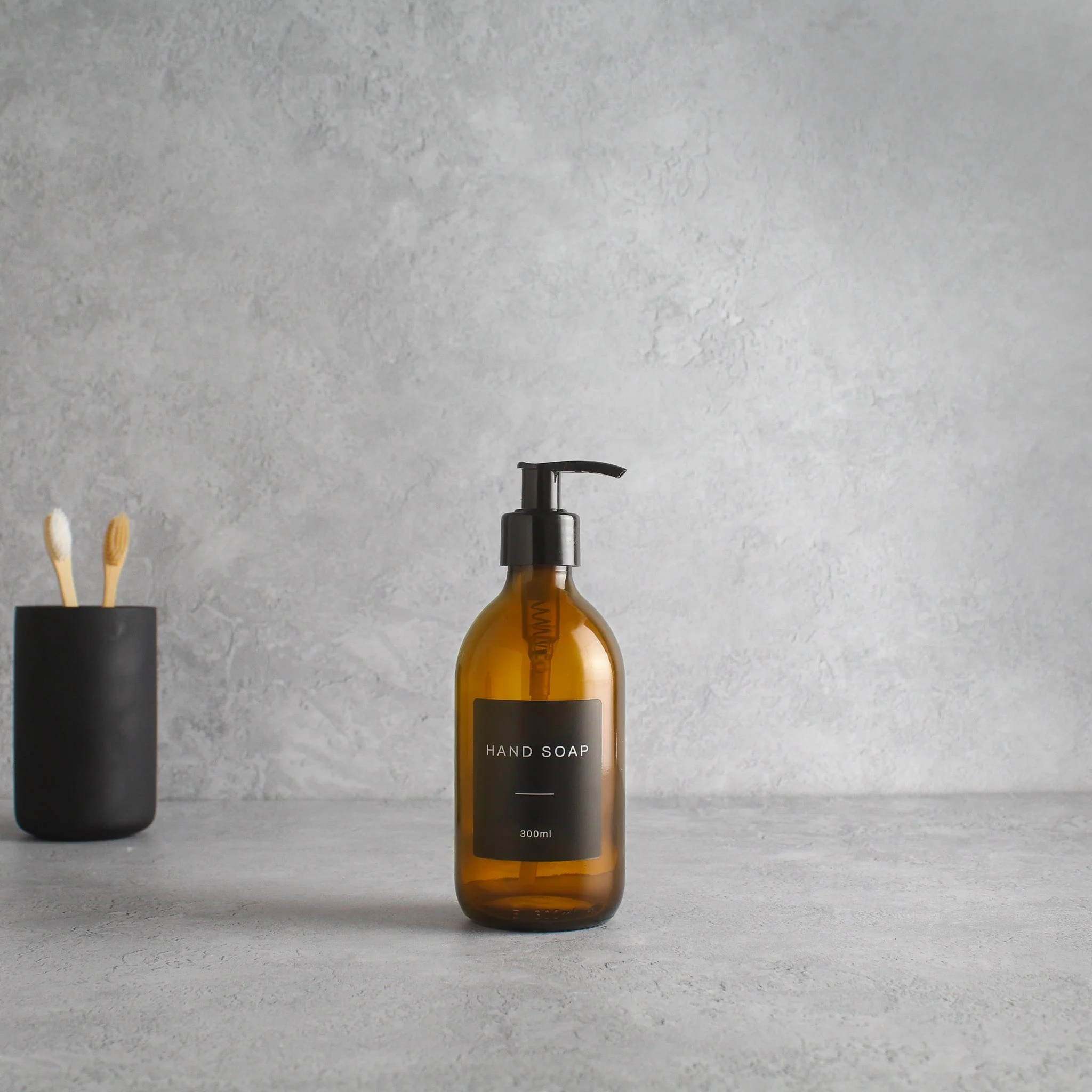 Labelled Amber Glass Dispenser Bottle With Black Pump - Image 5