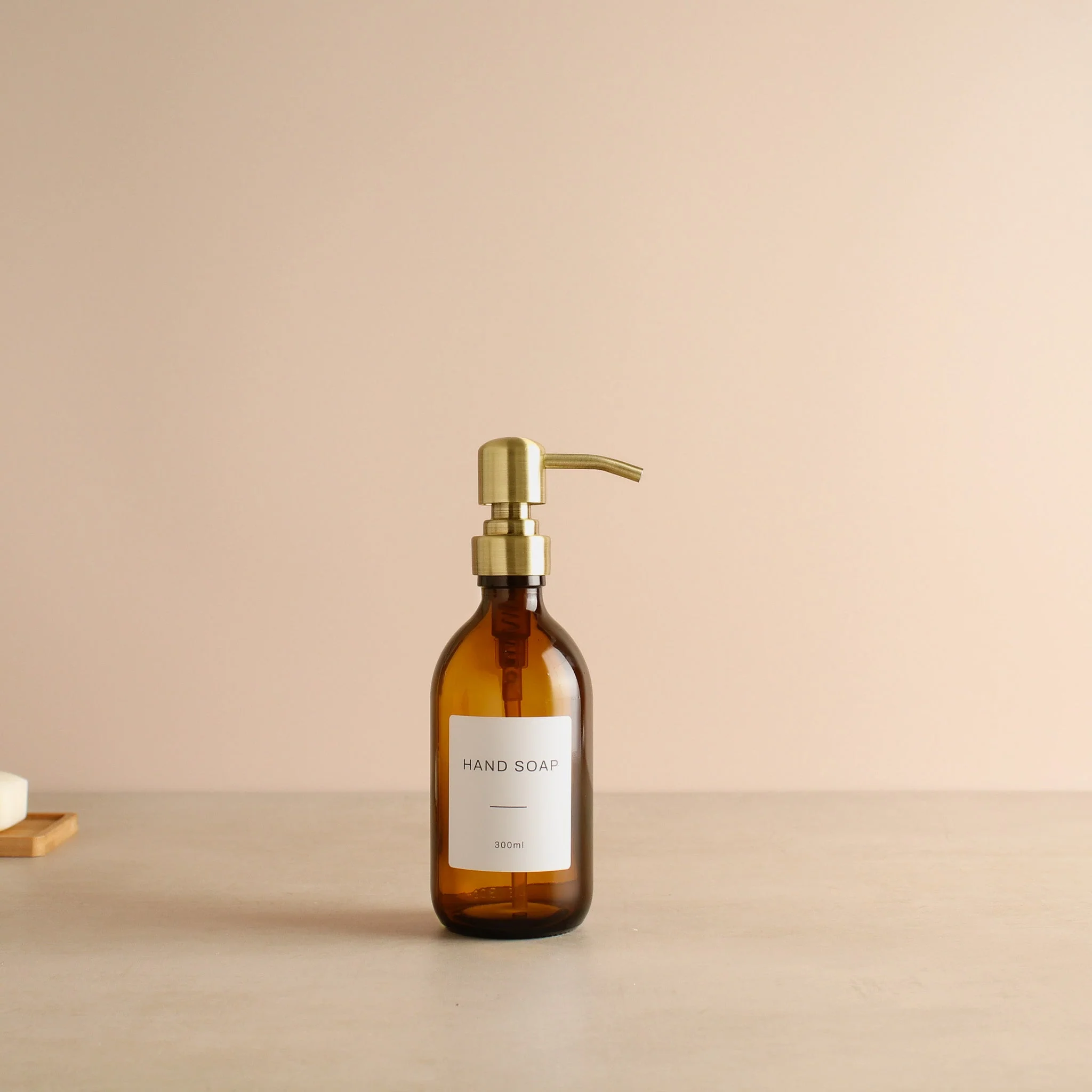 Labelled Amber Glass Dispenser Bottle With Gold Pump - Image 7