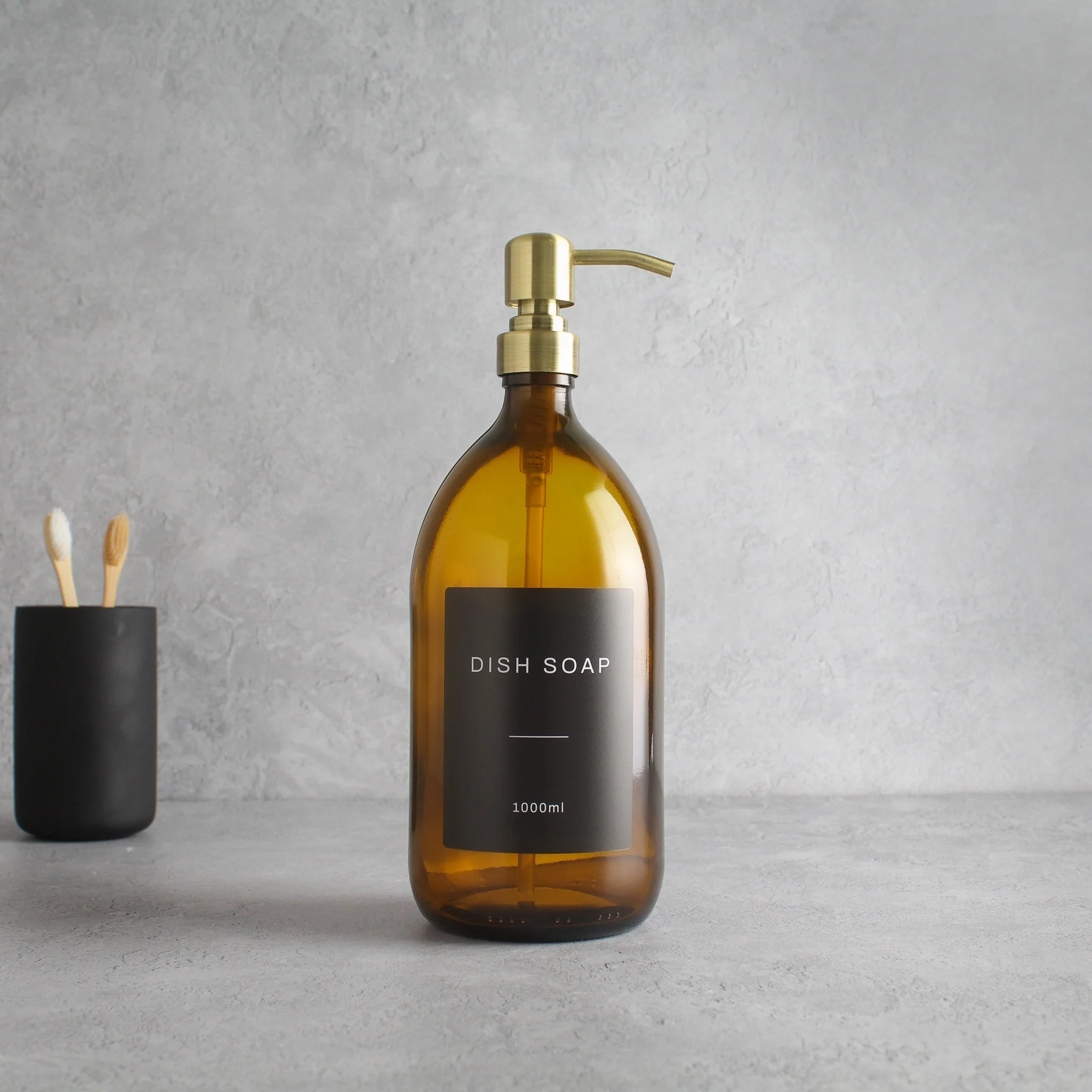 Labelled Amber Glass Dispenser Bottle With Gold Pump - Image 3