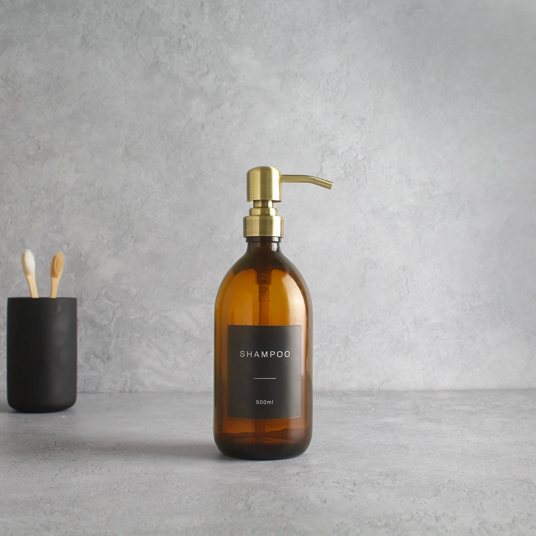 Labelled Amber Glass Dispenser Bottle With Gold Pump - Image 4