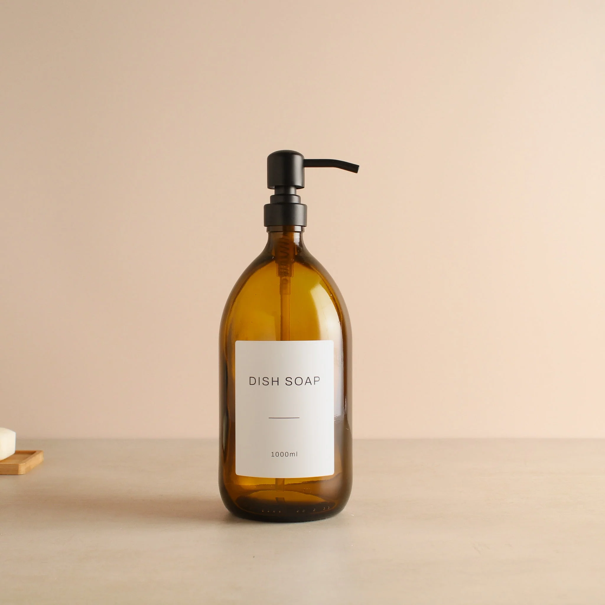 Labelled Amber Glass Dispenser Bottle With Matte Black Pump - Image 3