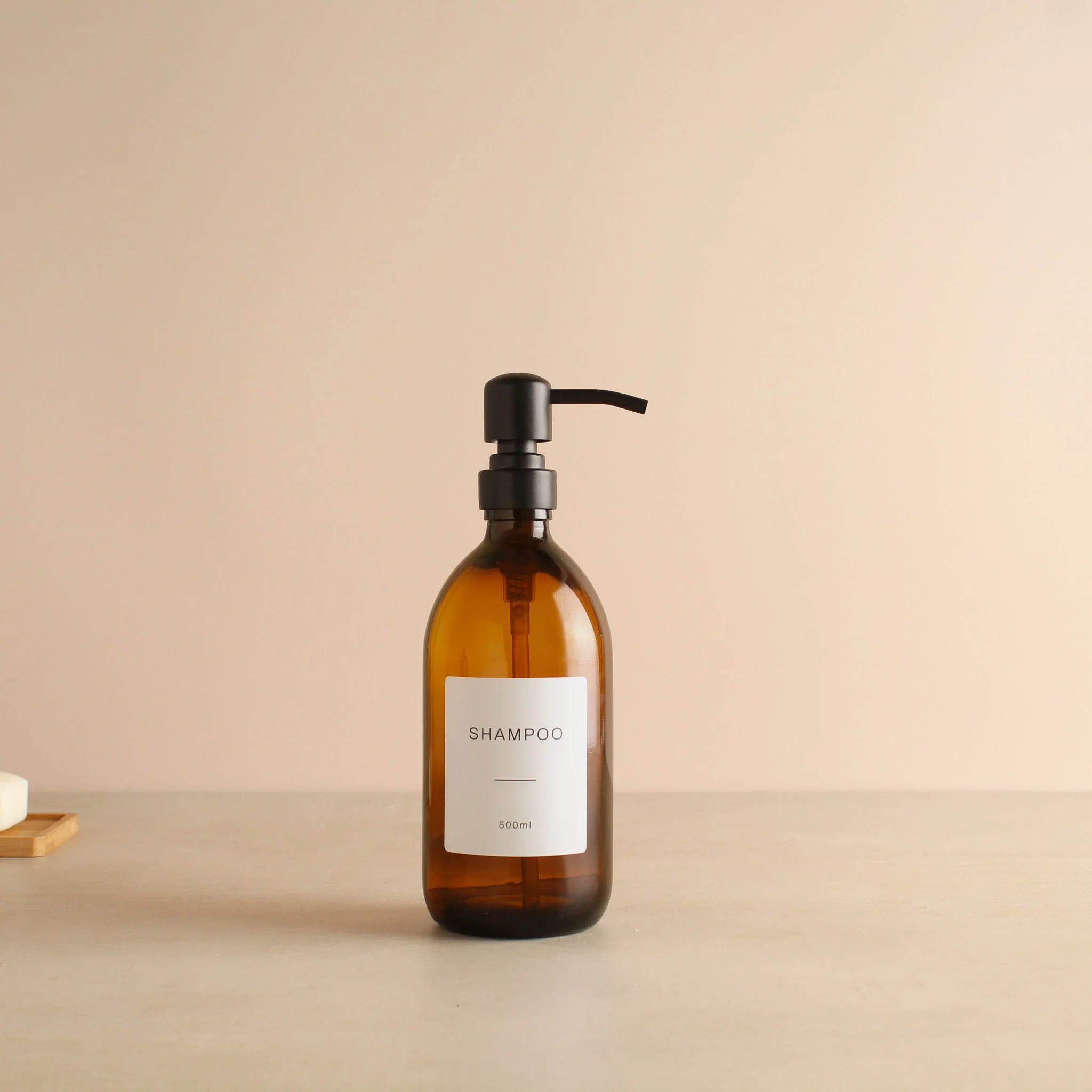 Labelled Amber Glass Dispenser Bottle With Matte Black Pump - Image 4
