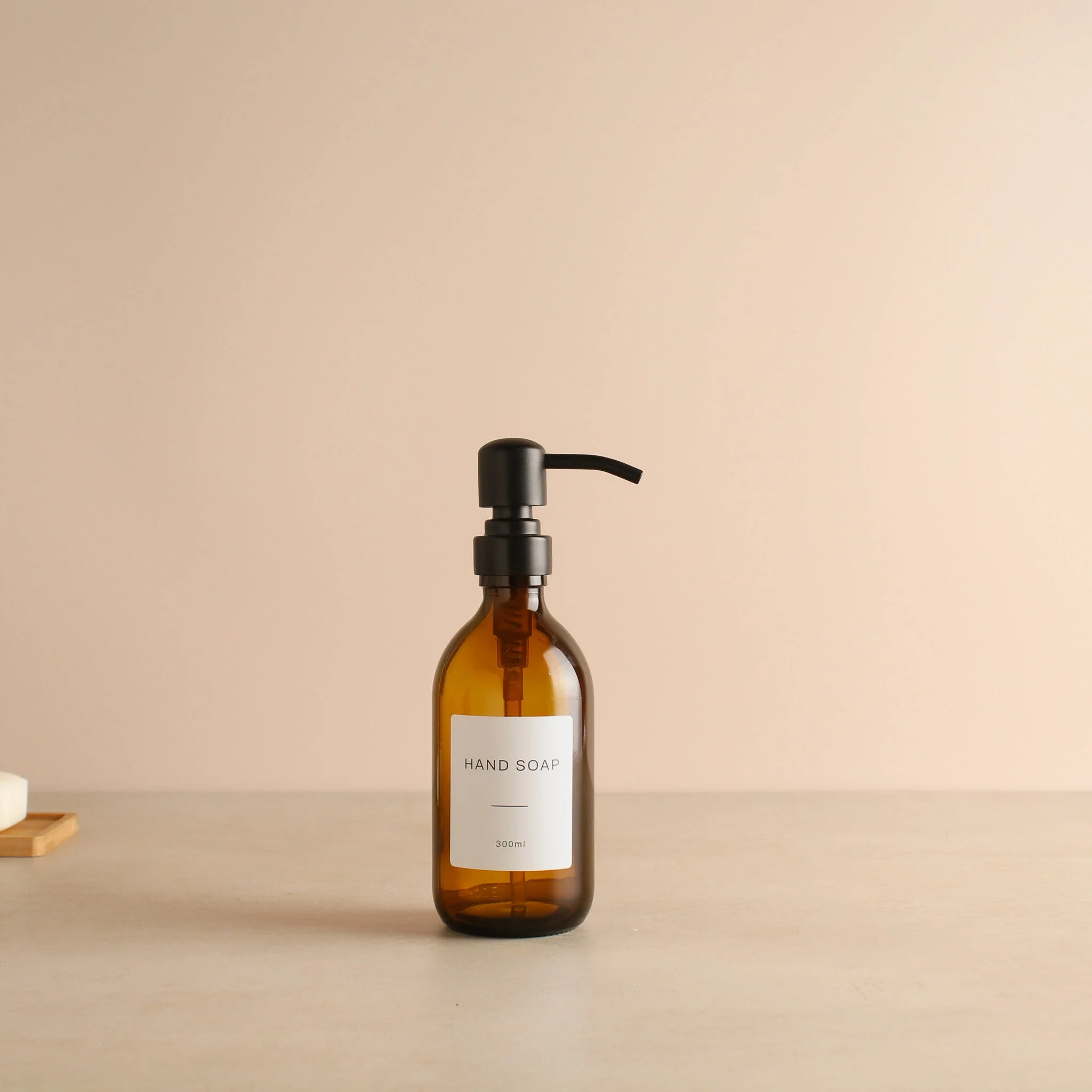 Labelled Amber Glass Dispenser Bottle With Matte Black Pump - Image 5