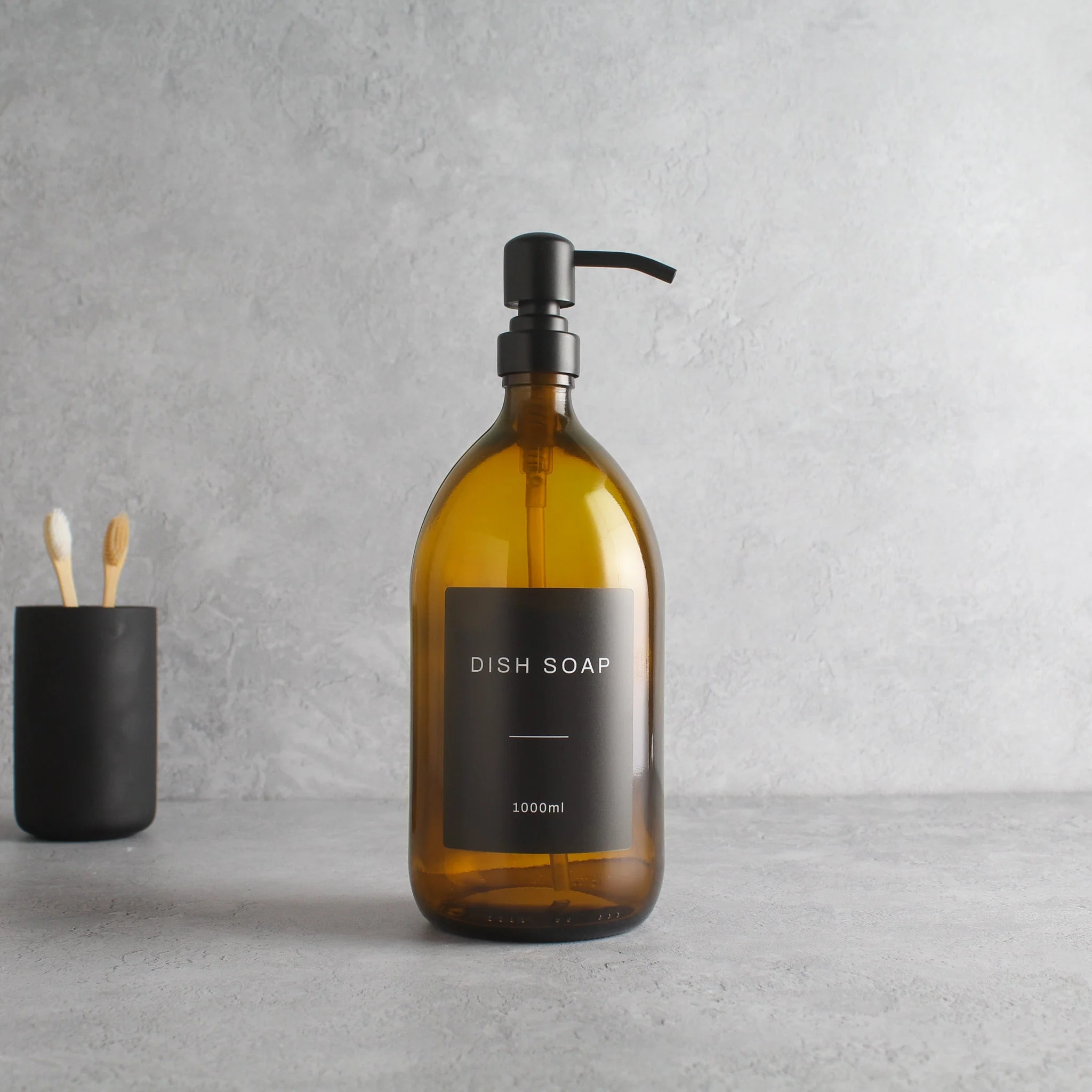 Labelled Amber Glass Dispenser Bottle With Matte Black Pump - Image 3