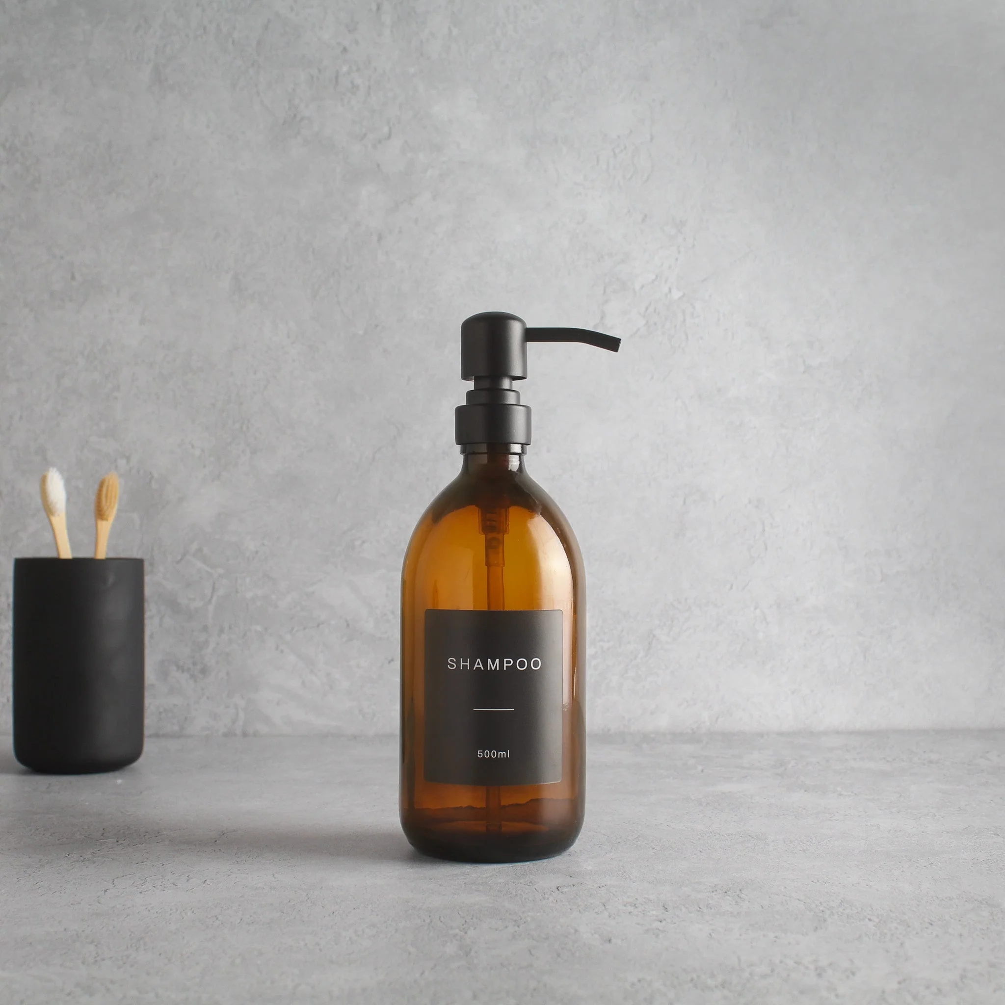 Labelled Amber Glass Dispenser Bottle With Matte Black Pump - Image 4