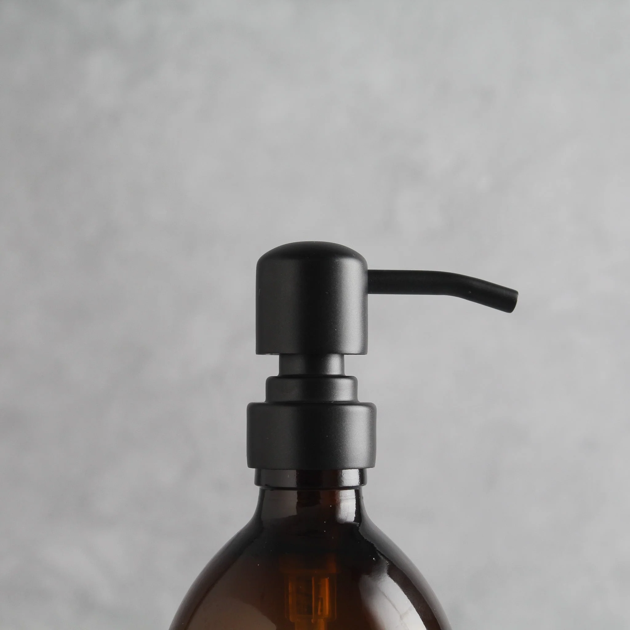 Labelled Amber Glass Dispenser Bottle With Matte Black Pump - Image 6