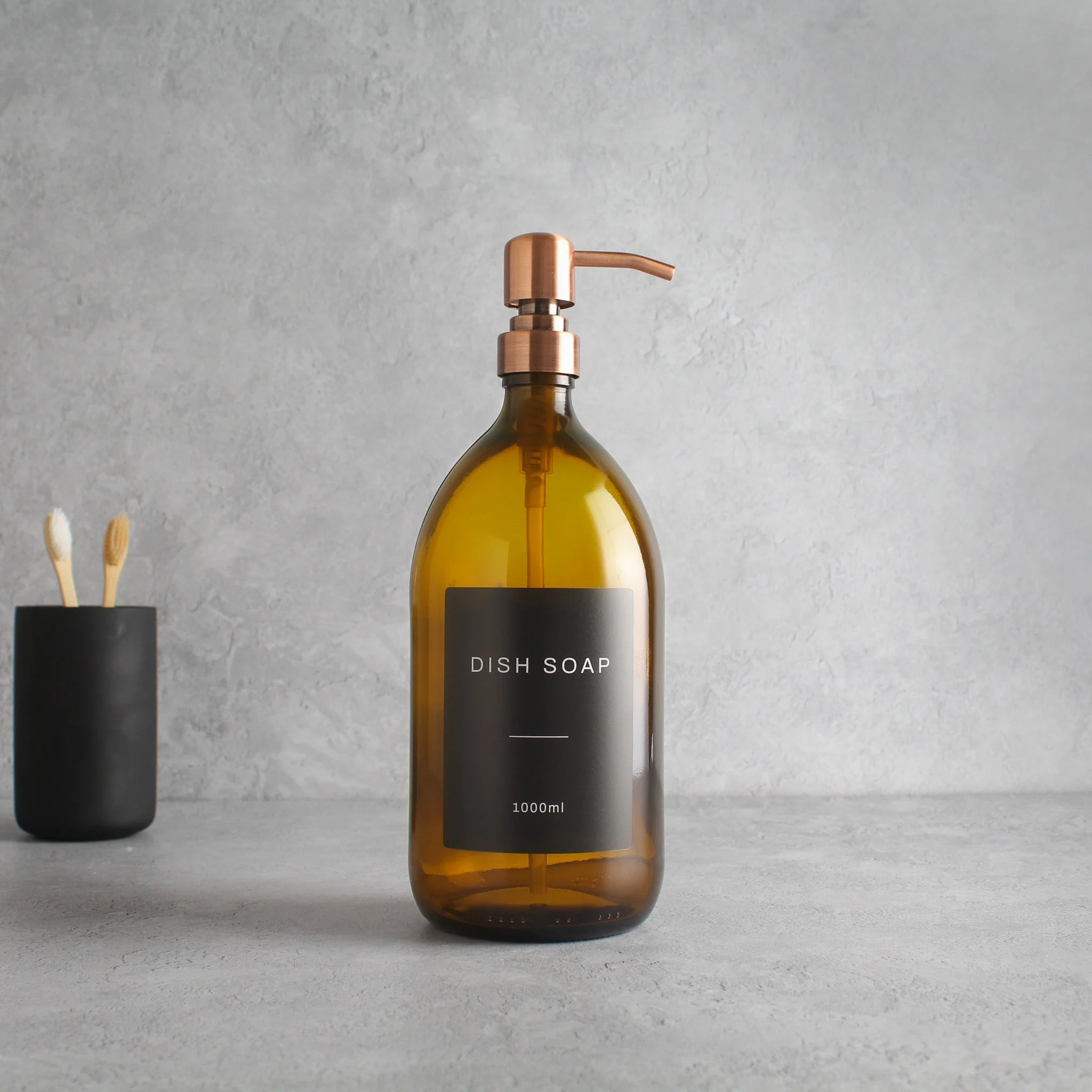 Labelled Amber Glass Dispenser Bottle With Rose Gold Pump - Image 3