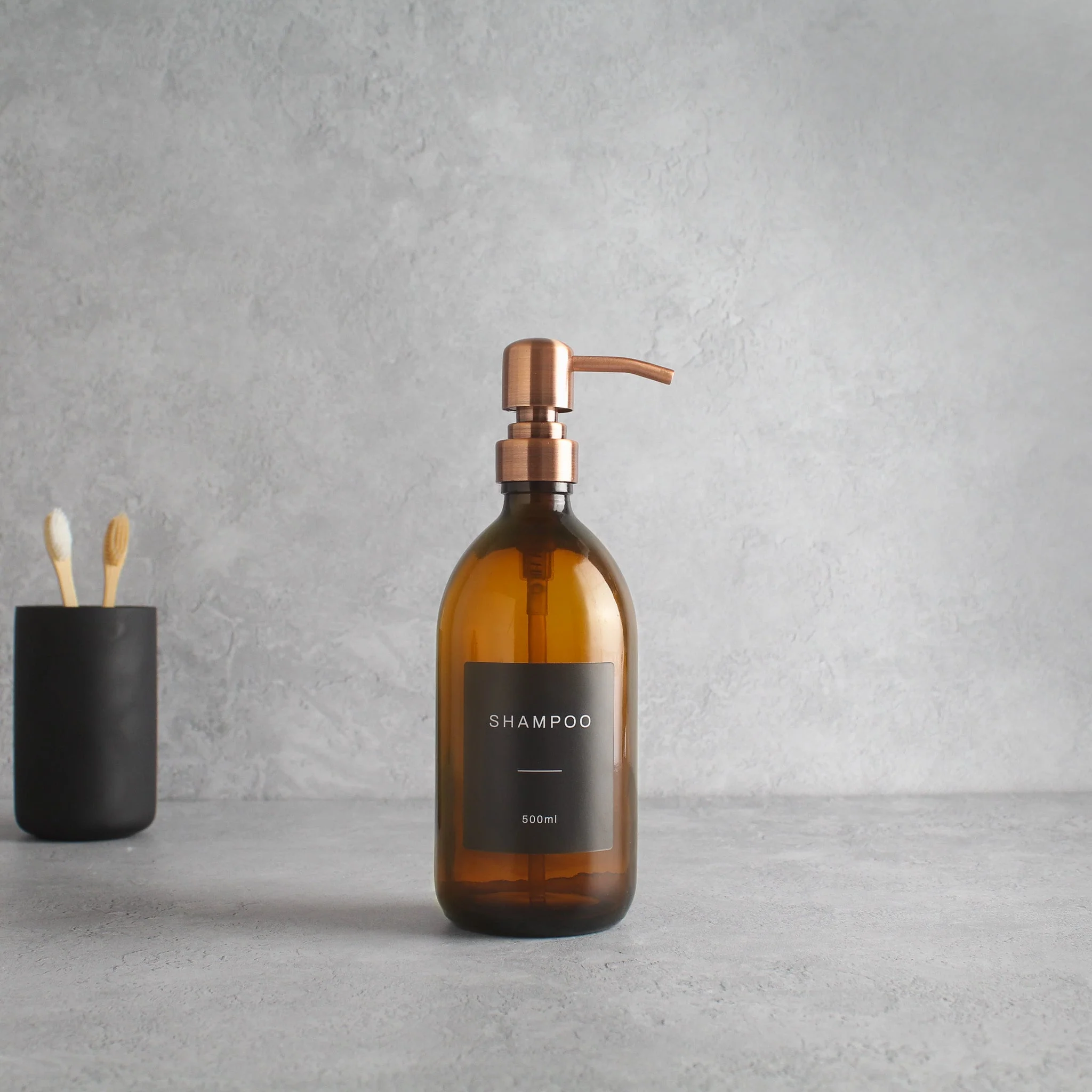 Labelled Amber Glass Dispenser Bottle With Rose Gold Pump - Image 4