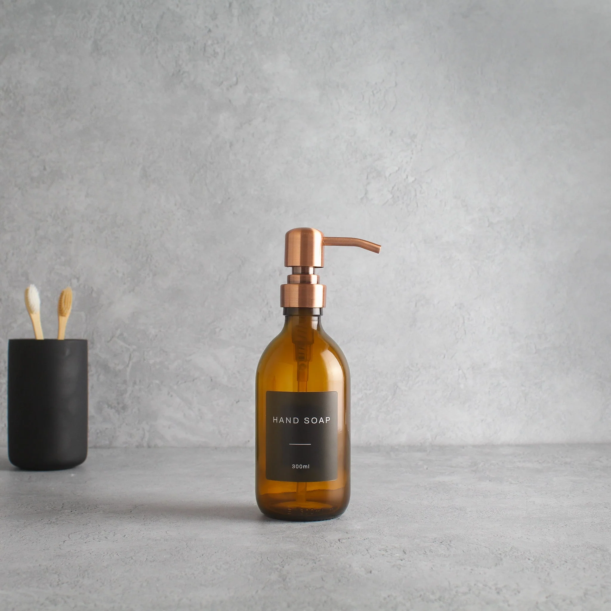Labelled Amber Glass Dispenser Bottle With Rose Gold Pump - Image 5