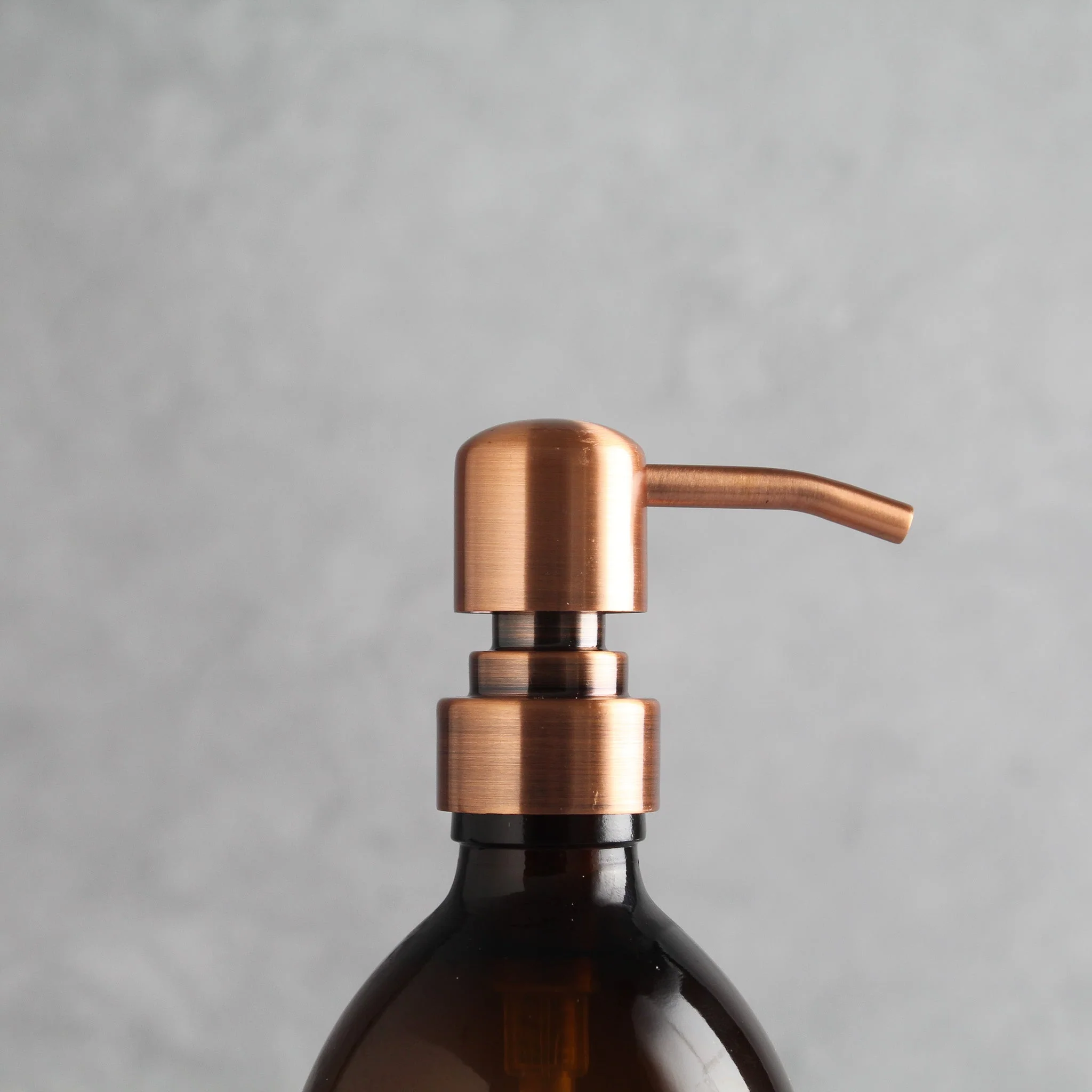 Labelled Amber Glass Dispenser Bottle With Rose Gold Pump - Image 6