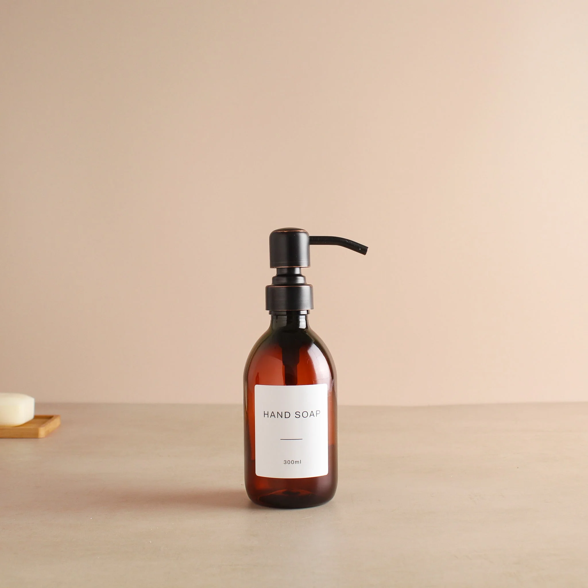 Labelled Amber Plastic Dispenser Bottle With Black/Copper Pump - Image 5