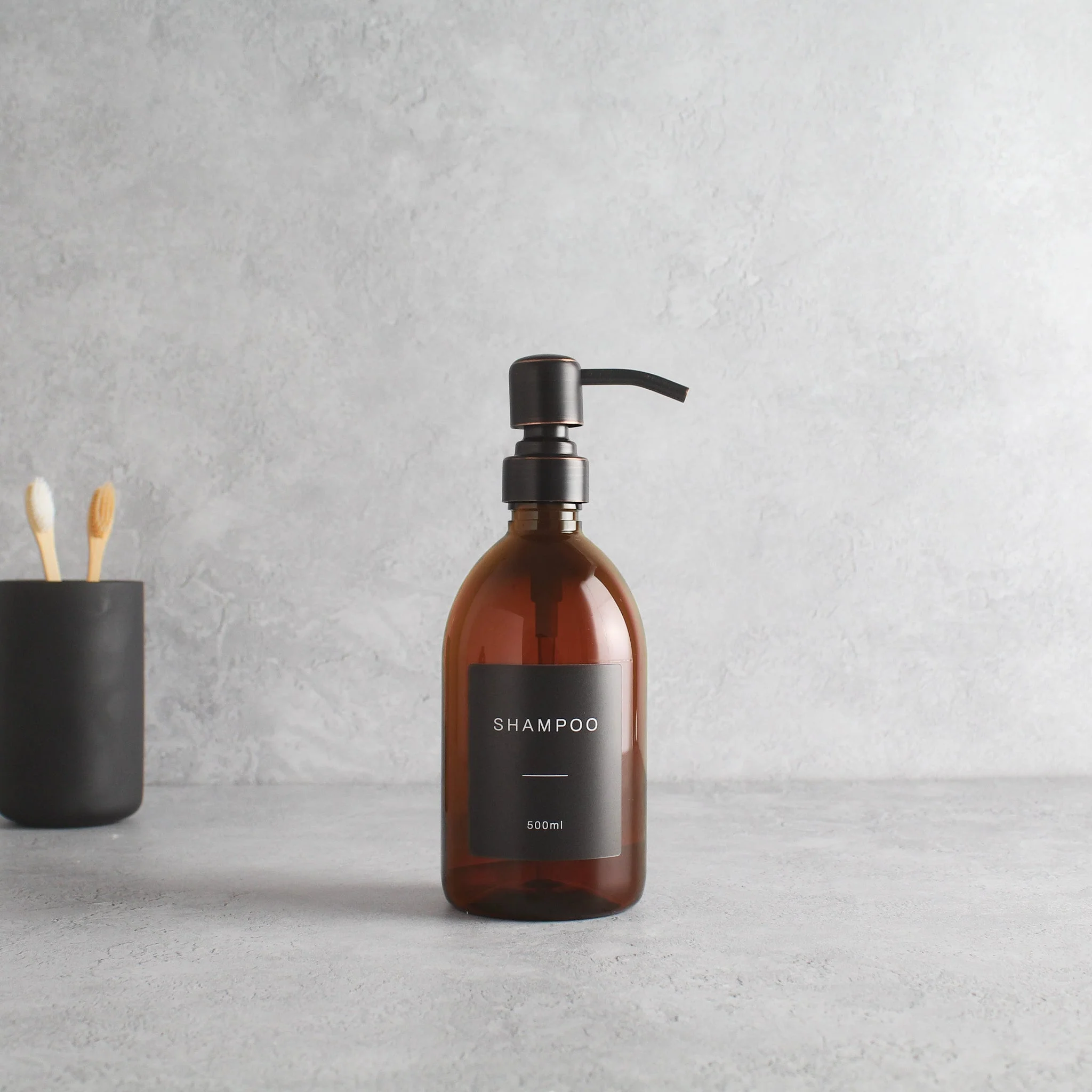 Labelled Amber Plastic Dispenser Bottle With Black/Copper Pump - Image 4
