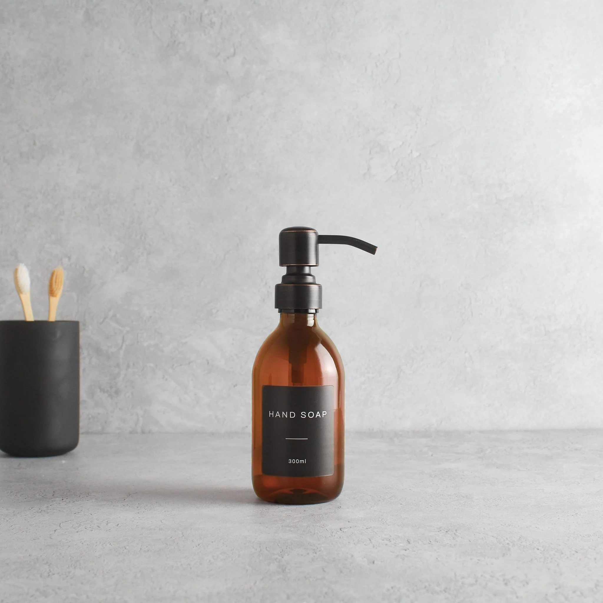 Labelled Amber Plastic Dispenser Bottle With Black/Copper Pump - Image 5