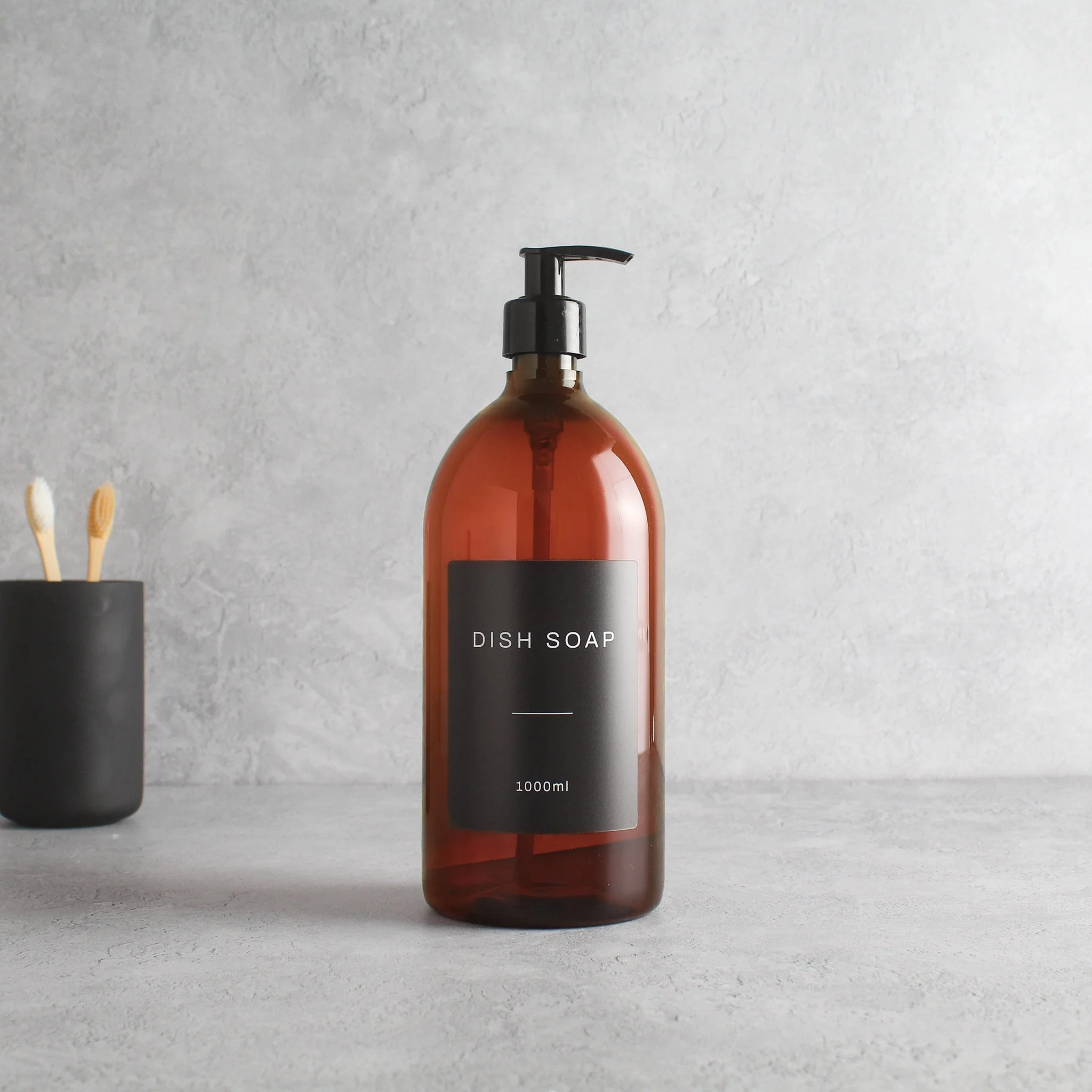Labelled Amber Plastic Dispenser Bottle With Black Pump - Image 3