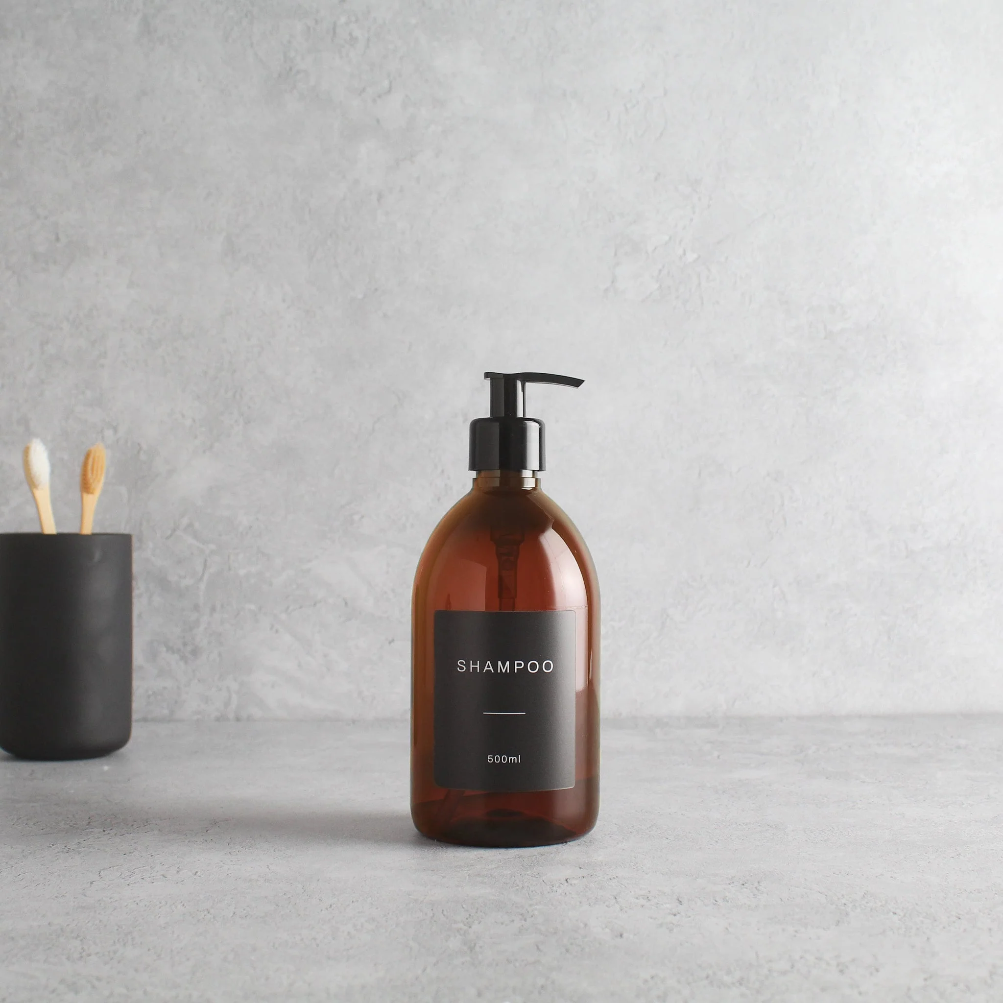 Labelled Amber Plastic Dispenser Bottle With Black Pump - Image 4