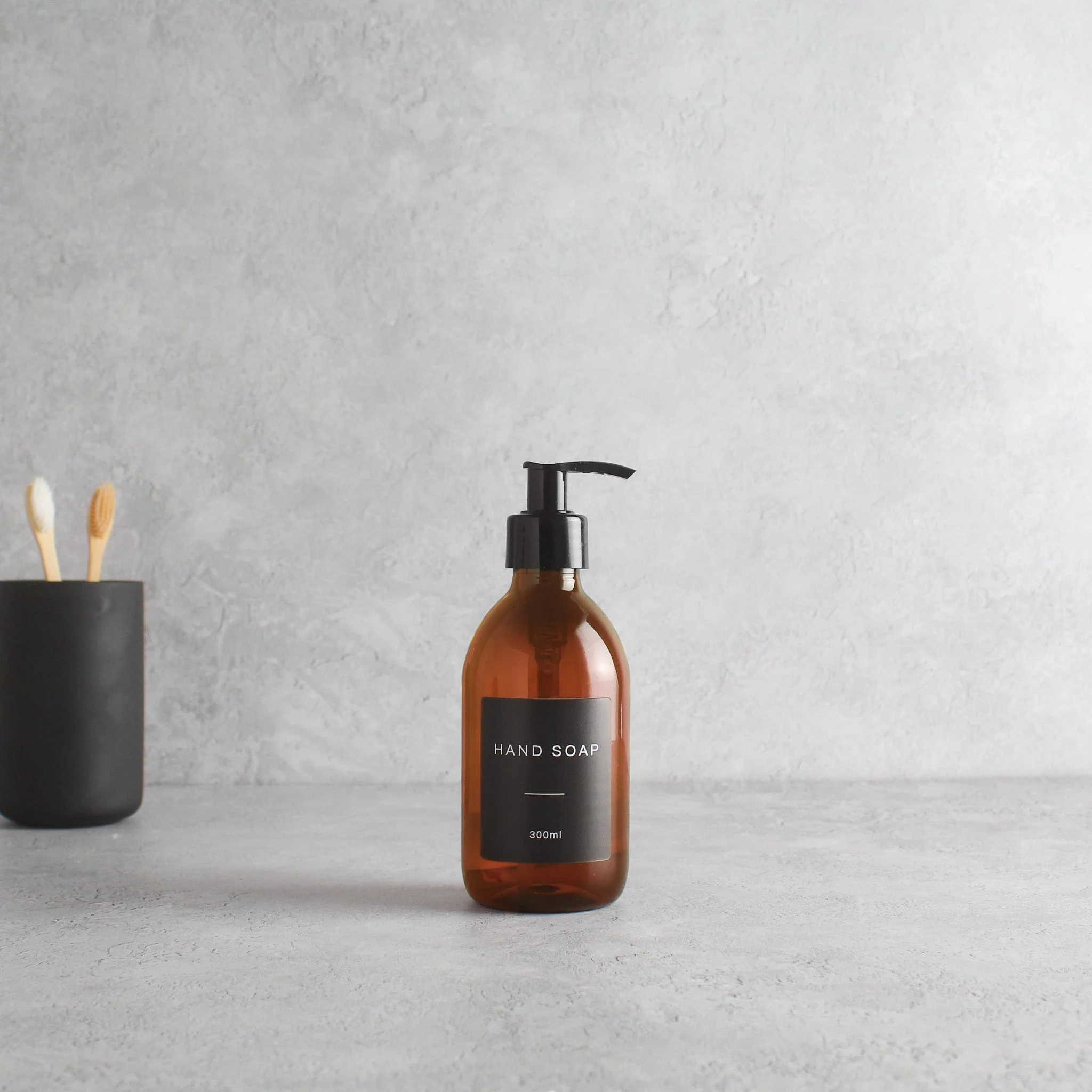 Labelled Amber Plastic Dispenser Bottle With Black Pump - Image 5