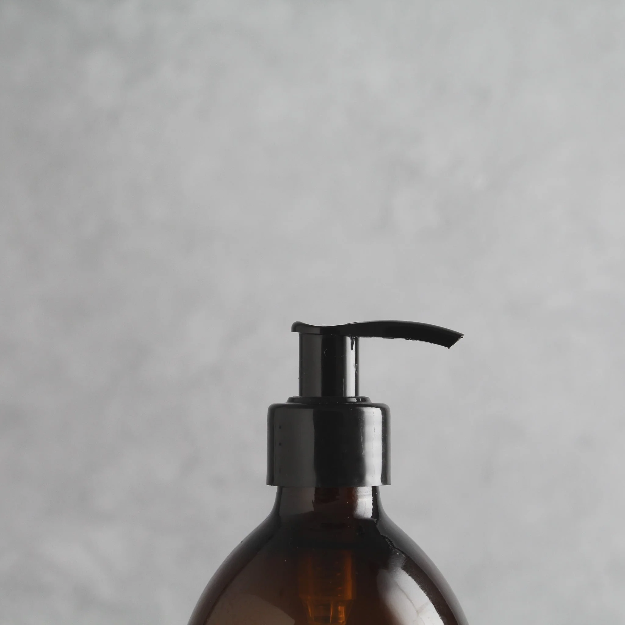 Labelled Amber Plastic Dispenser Bottle With Black Pump - Image 6