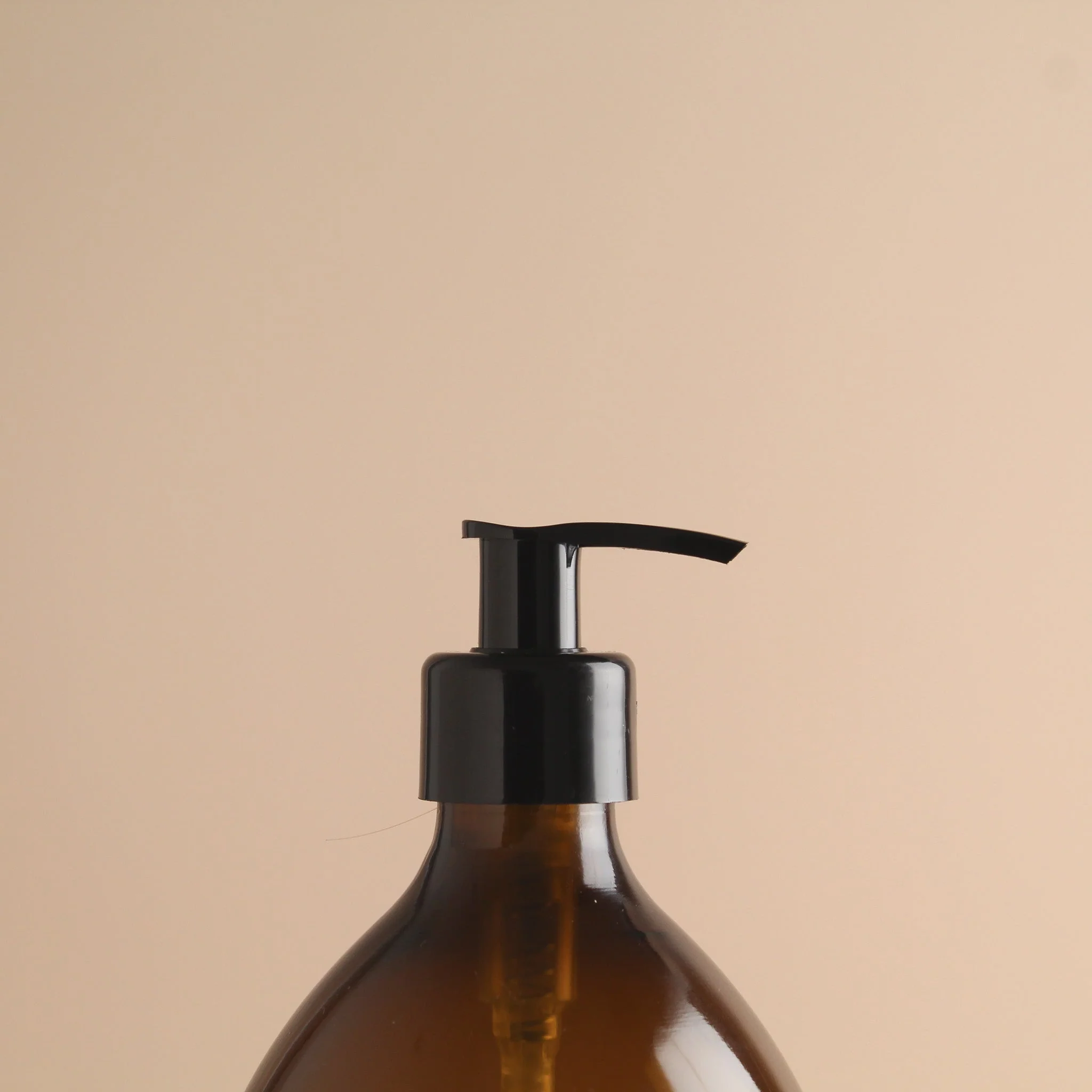 Labelled Amber Plastic Dispenser Bottle With Black Pump - Image 6