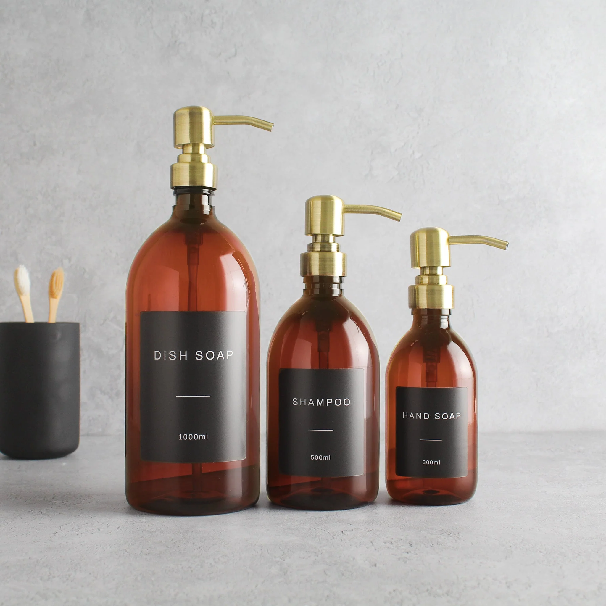 Labelled Amber Plastic Dispenser Bottle With Gold Pump - Image 2