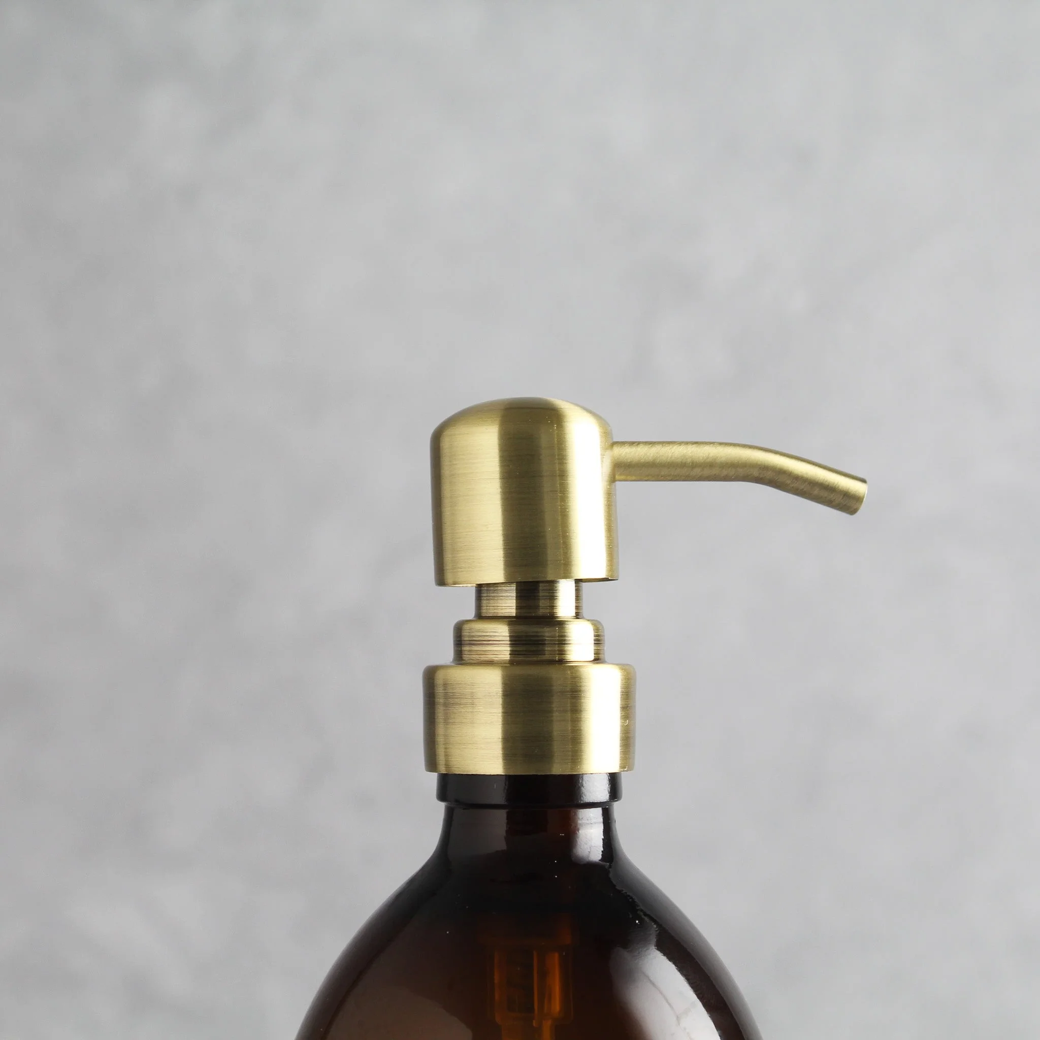 Labelled Amber Plastic Dispenser Bottle With Gold Pump - Image 6