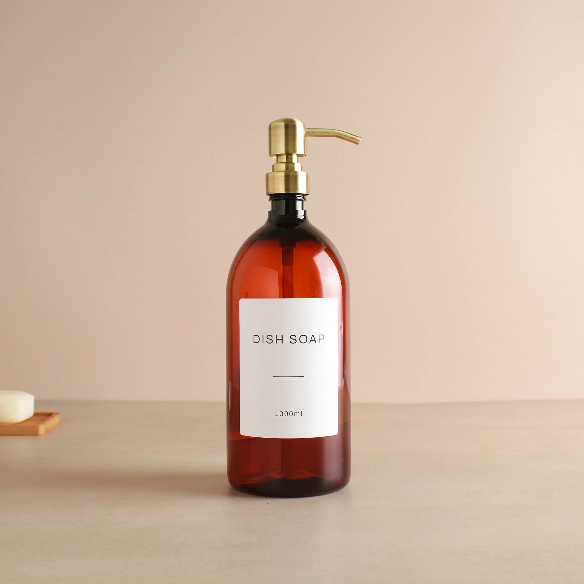 Labelled Amber Plastic Dispenser Bottle With Gold Pump - Image 3