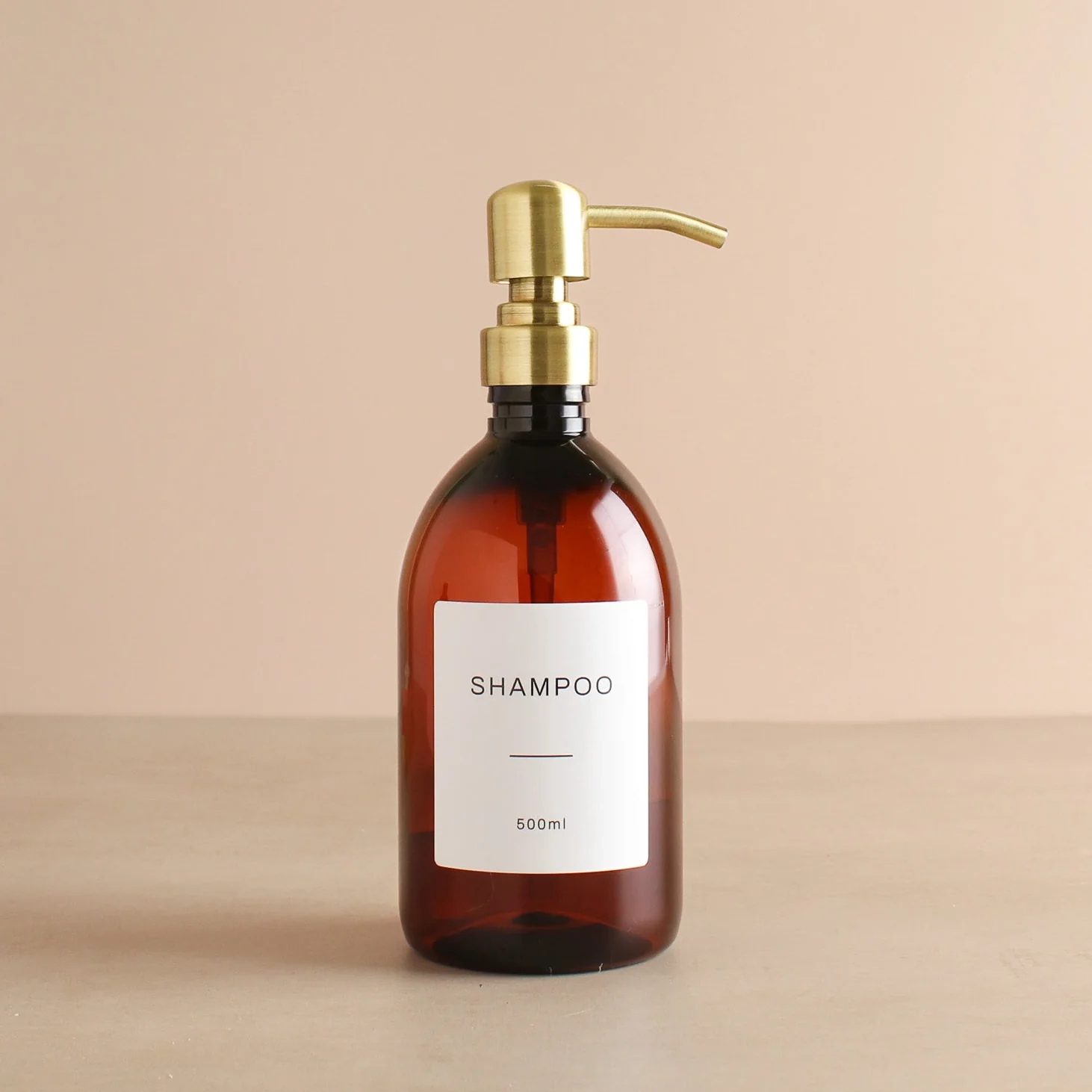 Labelled Amber Plastic Dispenser Bottle With Gold Pump - Image 4