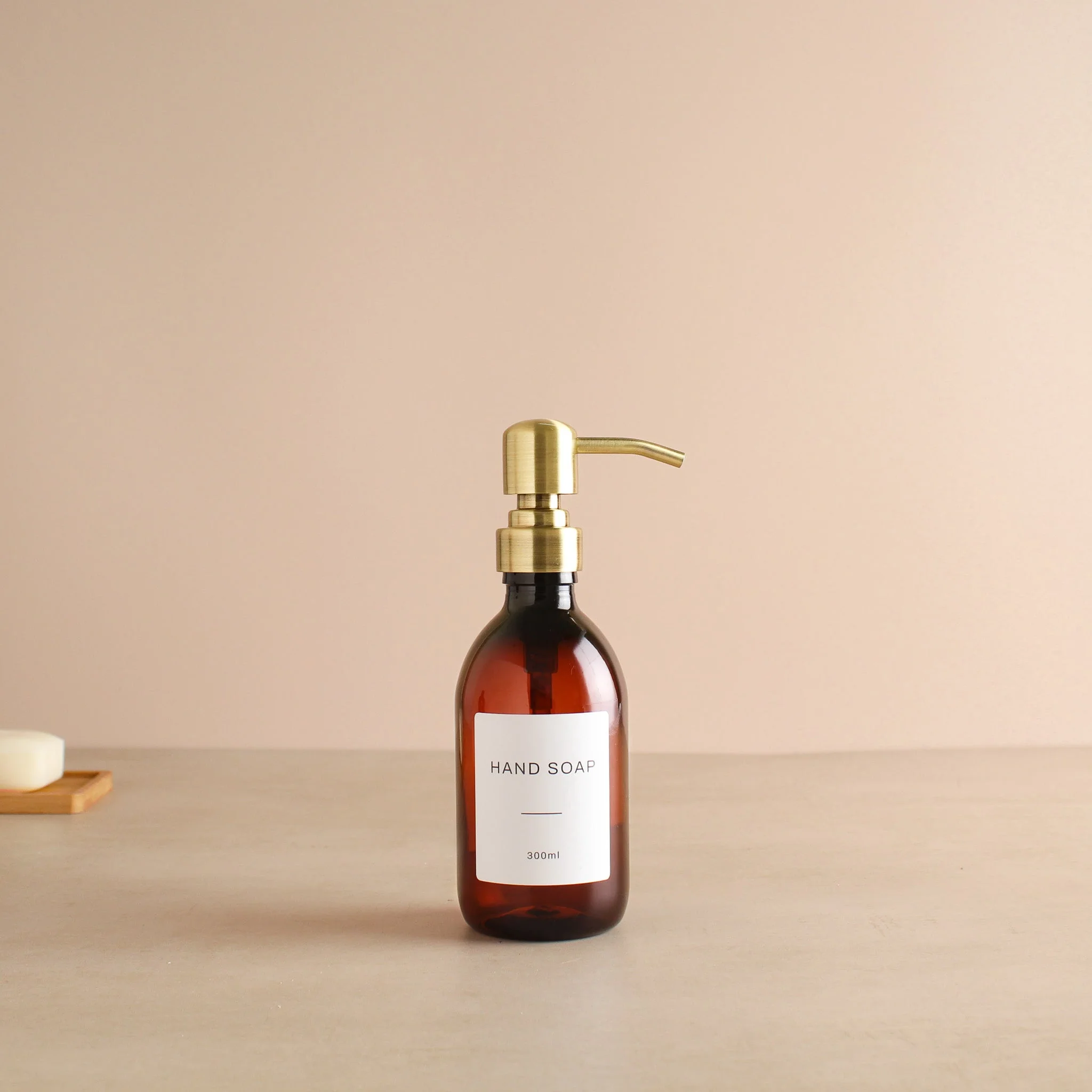 Labelled Amber Plastic Dispenser Bottle With Gold Pump - Image 5