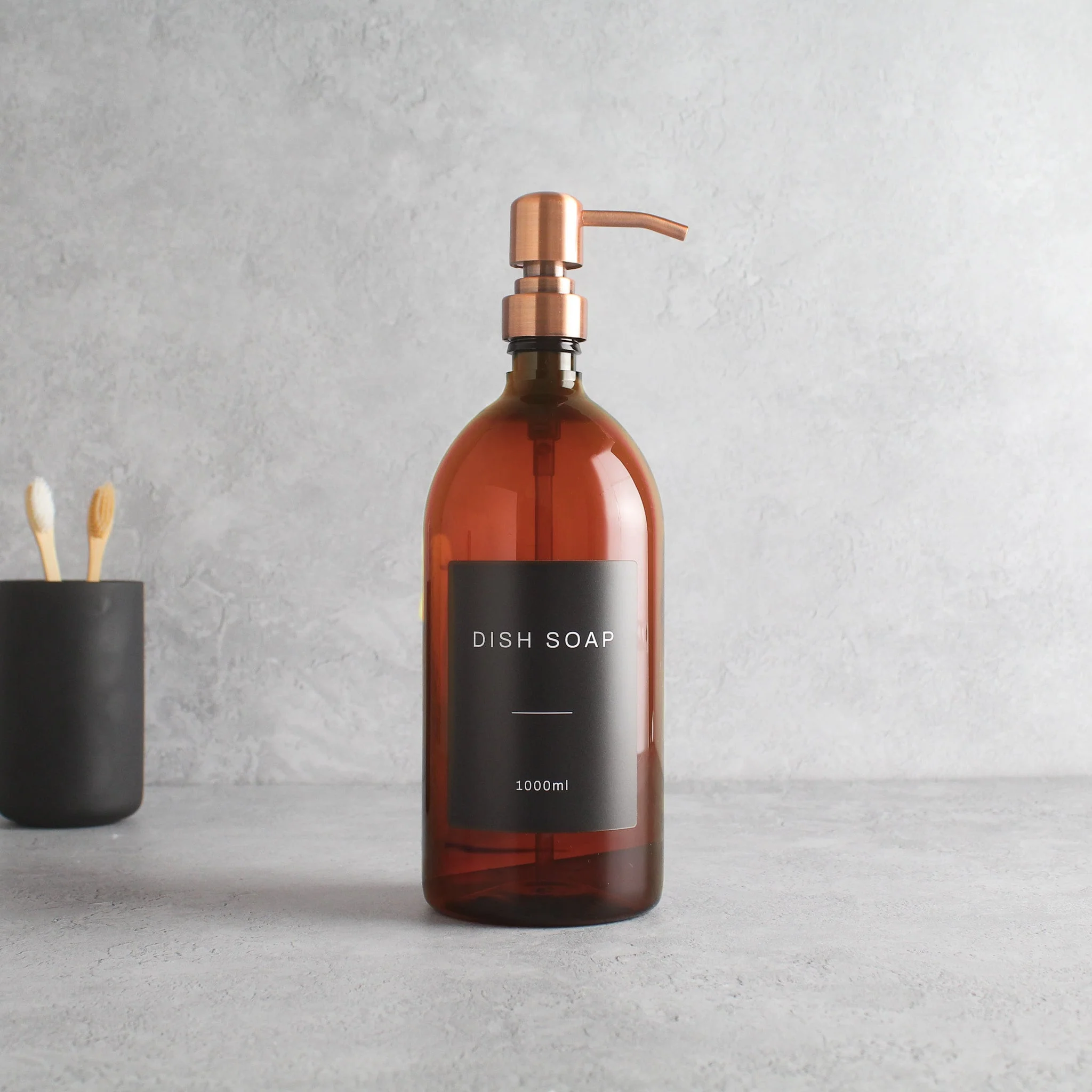 Labelled Amber Plastic Dispenser Bottle With Rose Gold Pump - Image 3