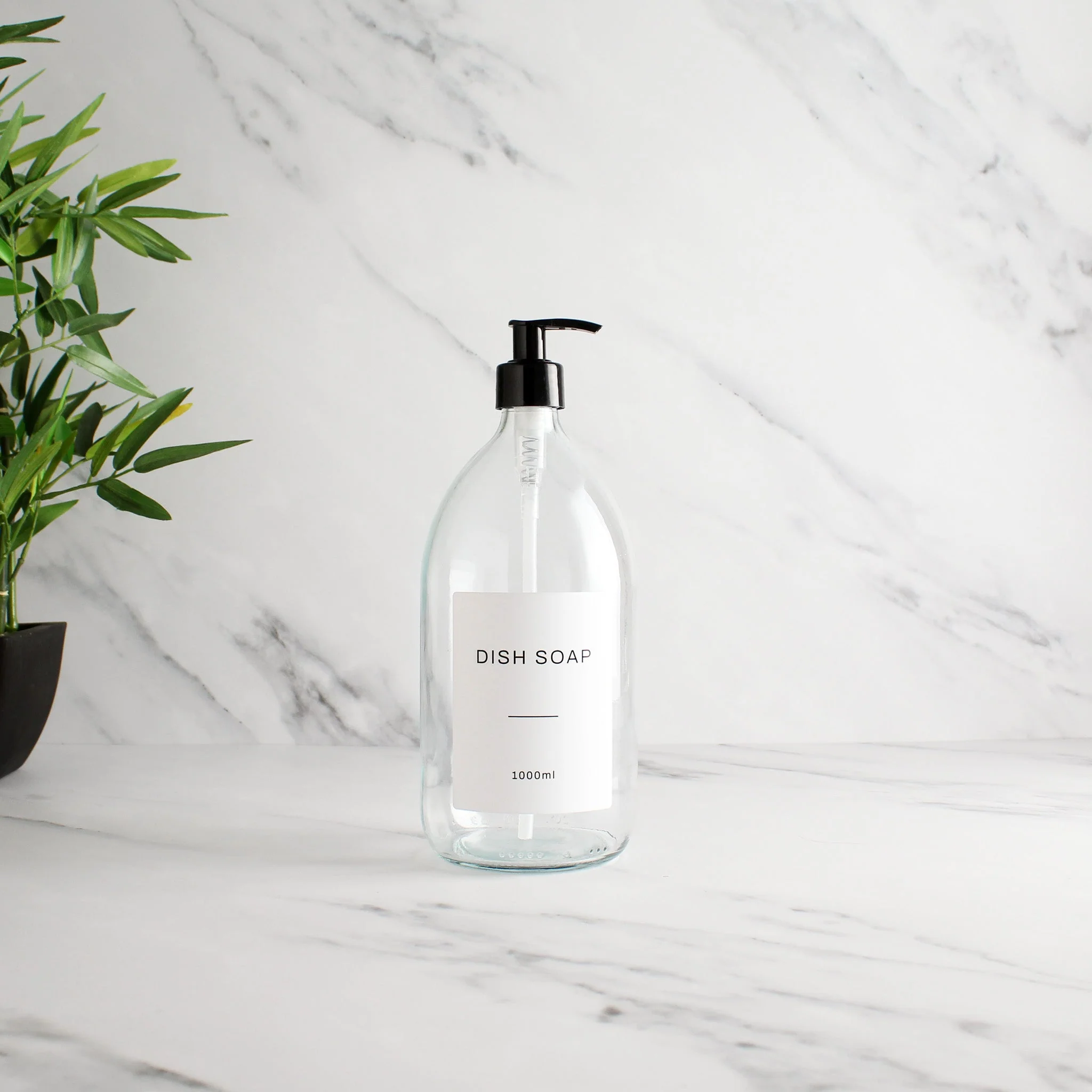 Labelled Clear Glass Dispenser Bottle With Black Pump - Image 3