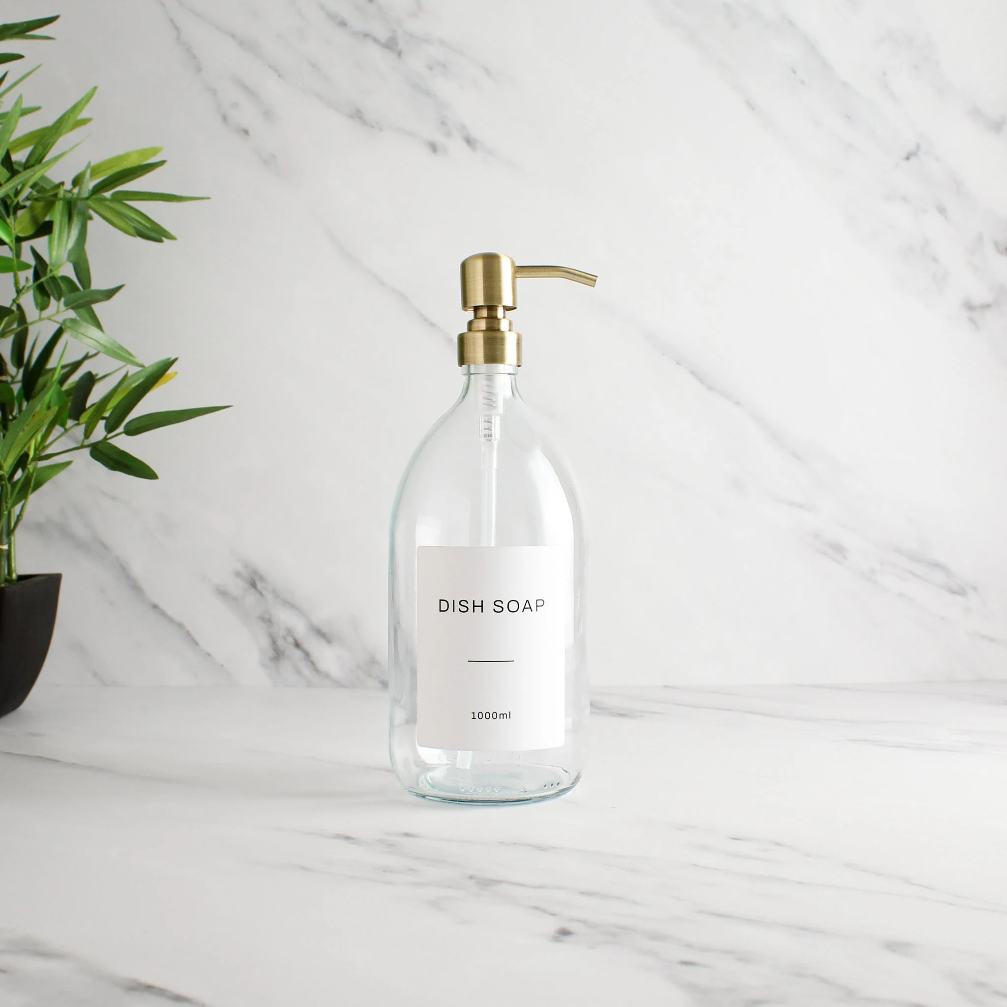 Labelled Clear Glass Dispenser Bottle With Gold Pump - Image 3
