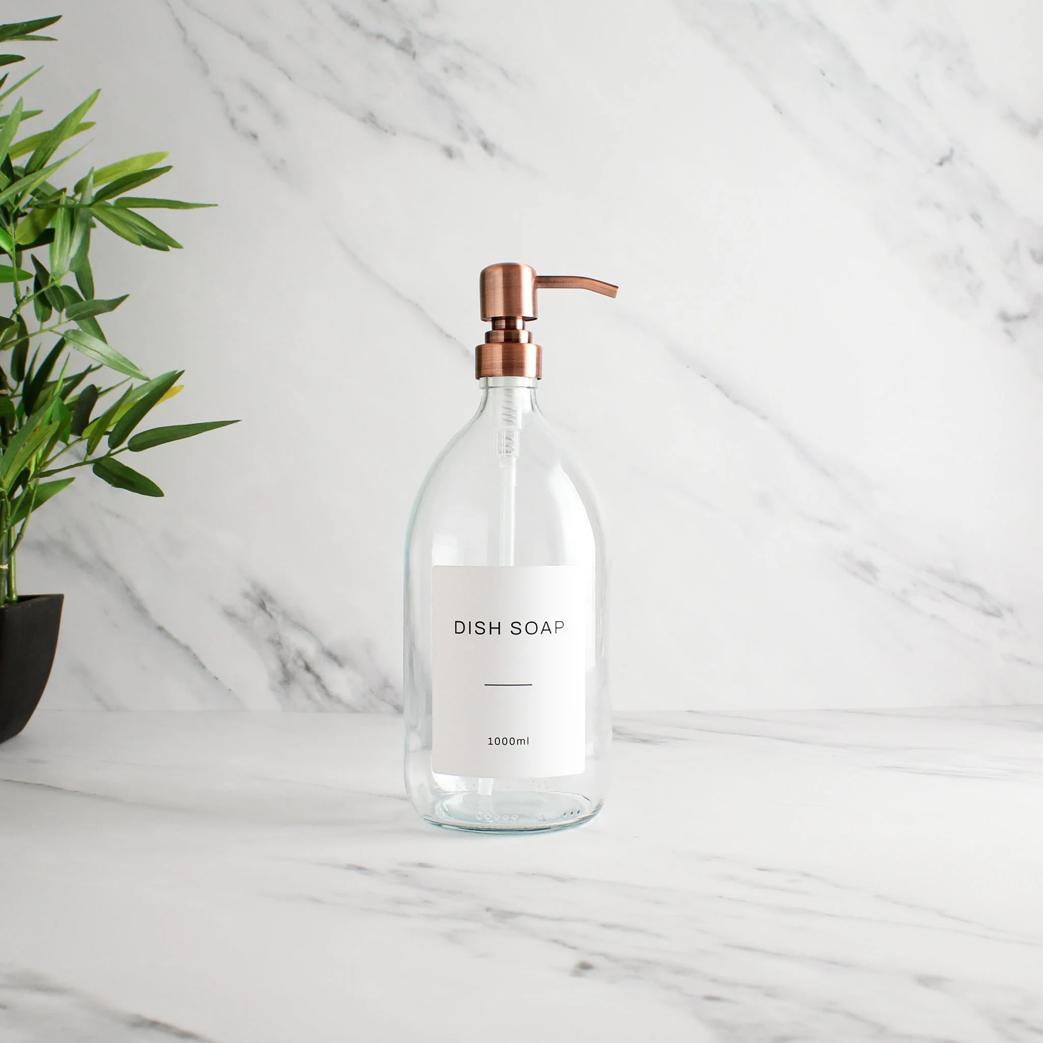 Labelled Clear Glass Dispenser Bottle With Rose Gold Pump - Image 3