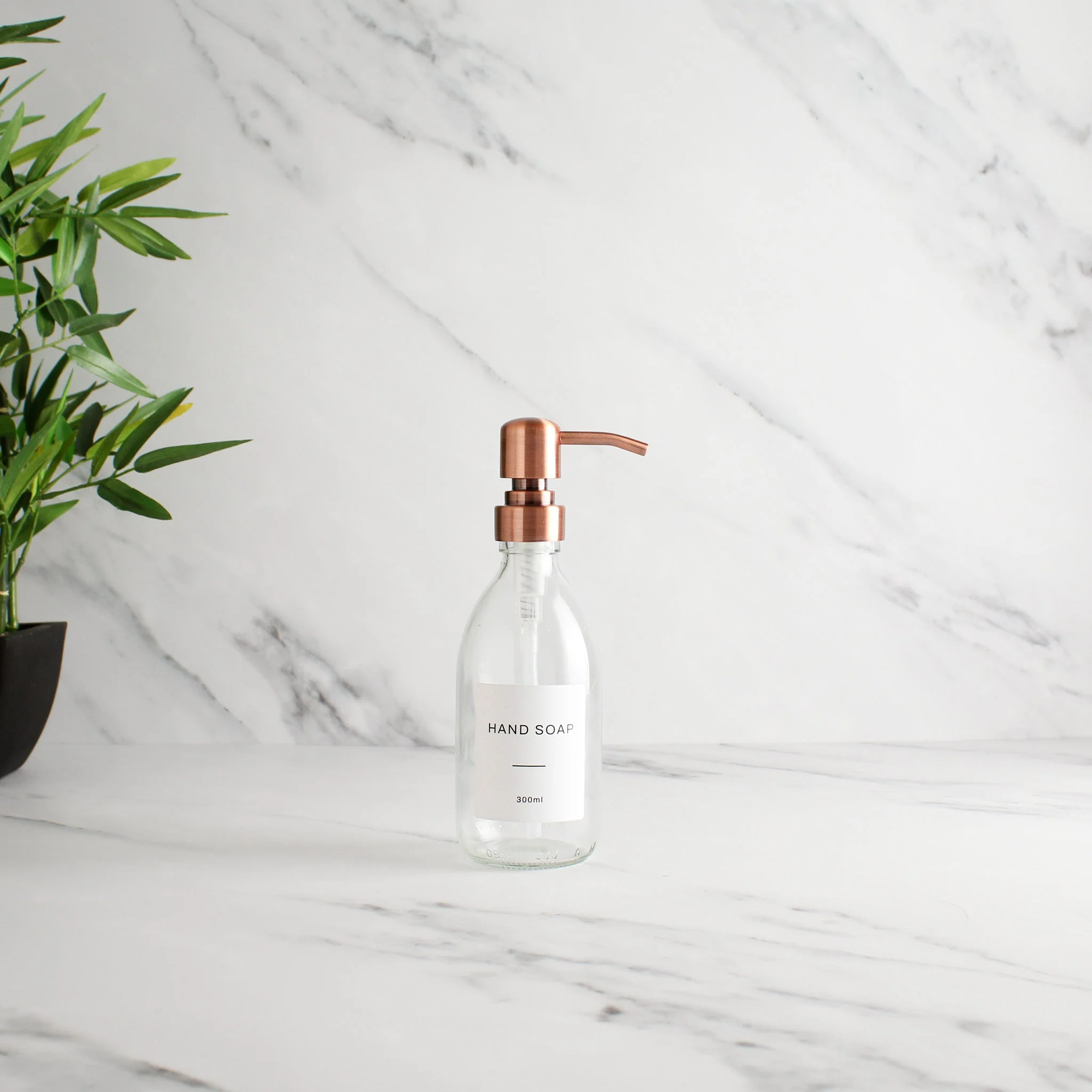 Labelled Clear Glass Dispenser Bottle With Rose Gold Pump - Image 5