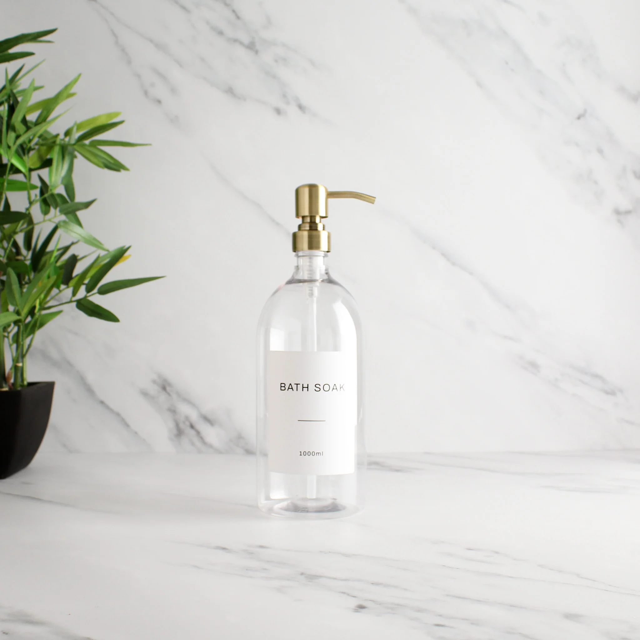 Labelled Clear Plastic Dispenser Bottle With Gold Pump - Image 2