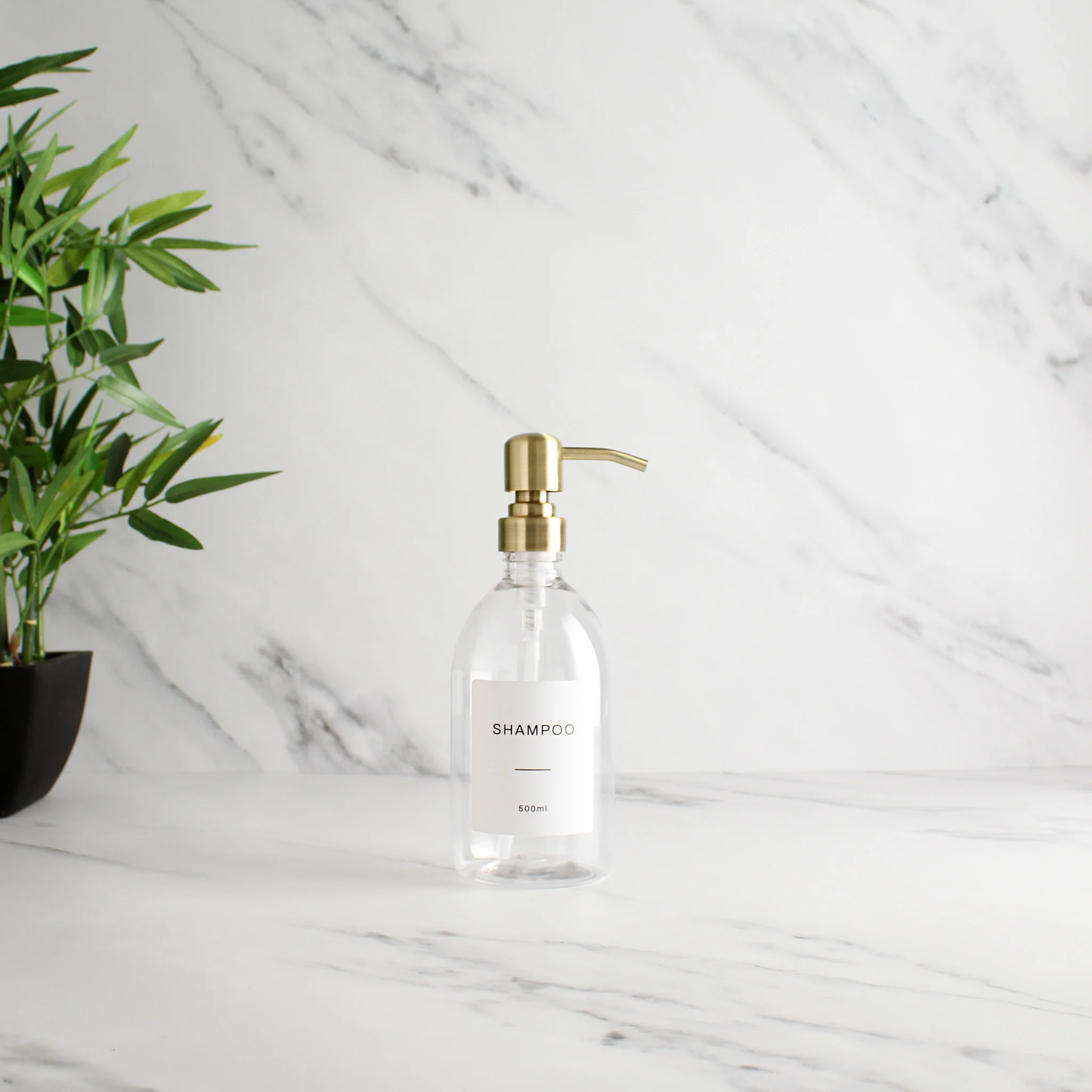 Labelled Clear Plastic Dispenser Bottle With Gold Pump - Image 3