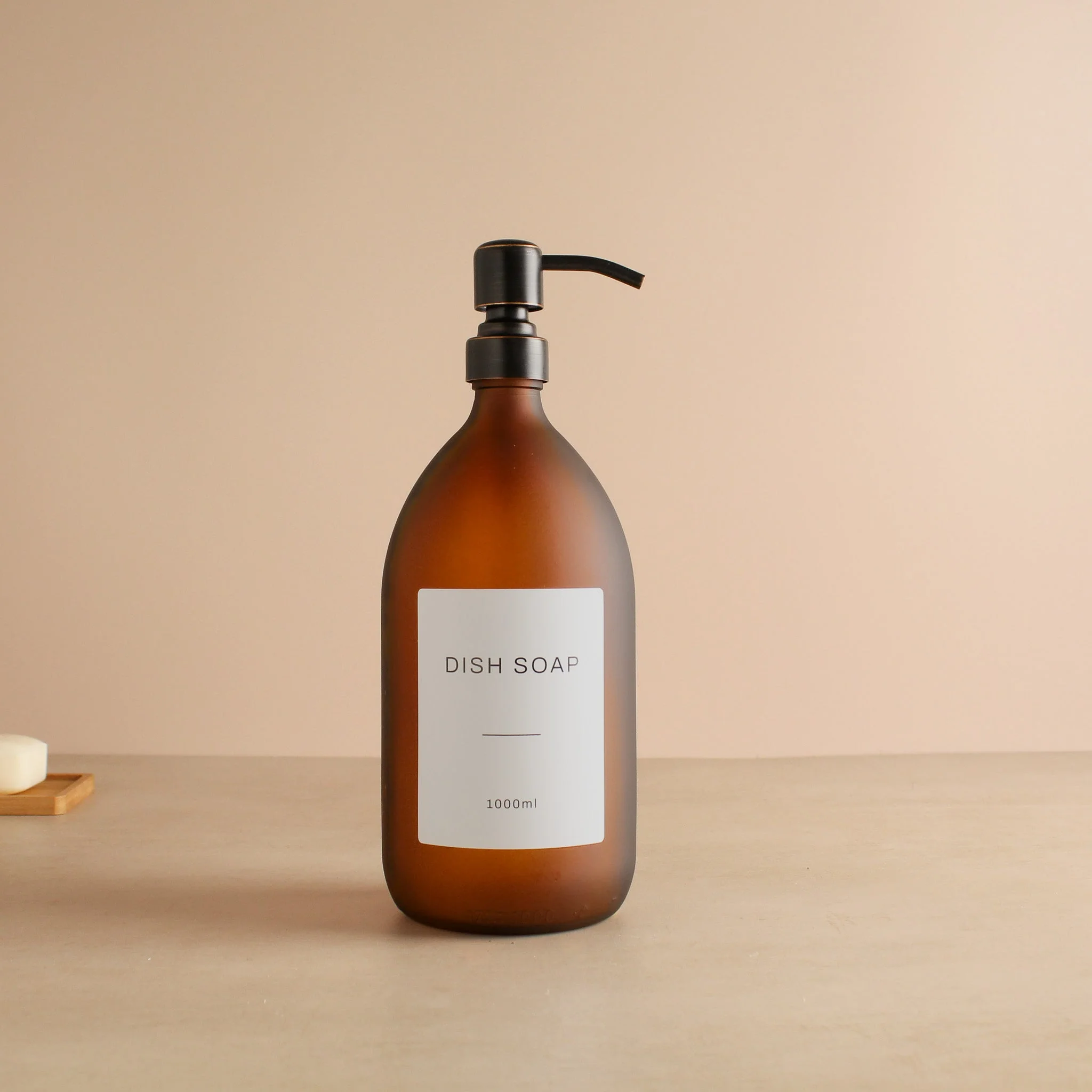 Labelled Frosted Amber Glass Dispenser Bottle With Black/Copper Pump - Image 3