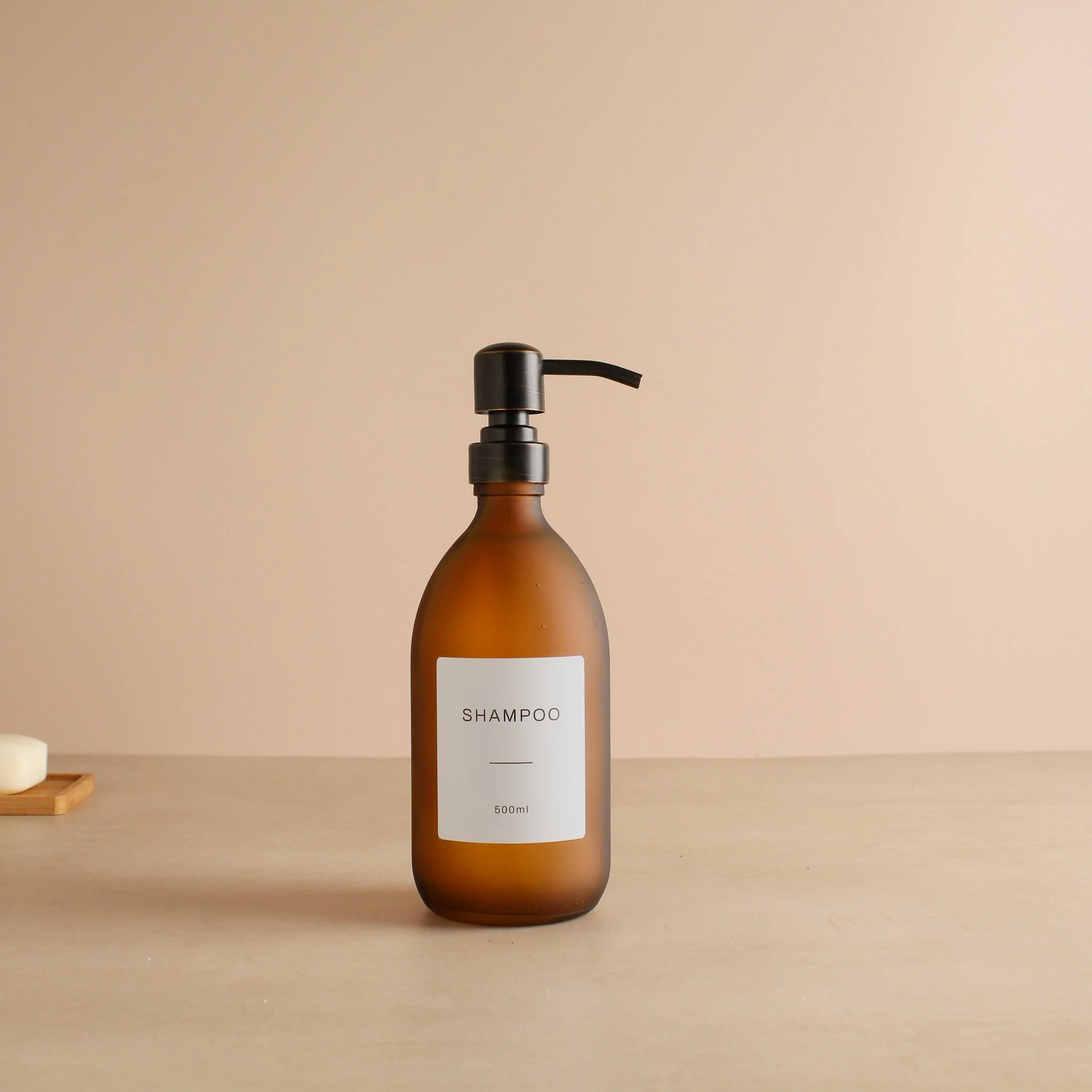 Labelled Frosted Amber Glass Dispenser Bottle With Black/Copper Pump - Image 4