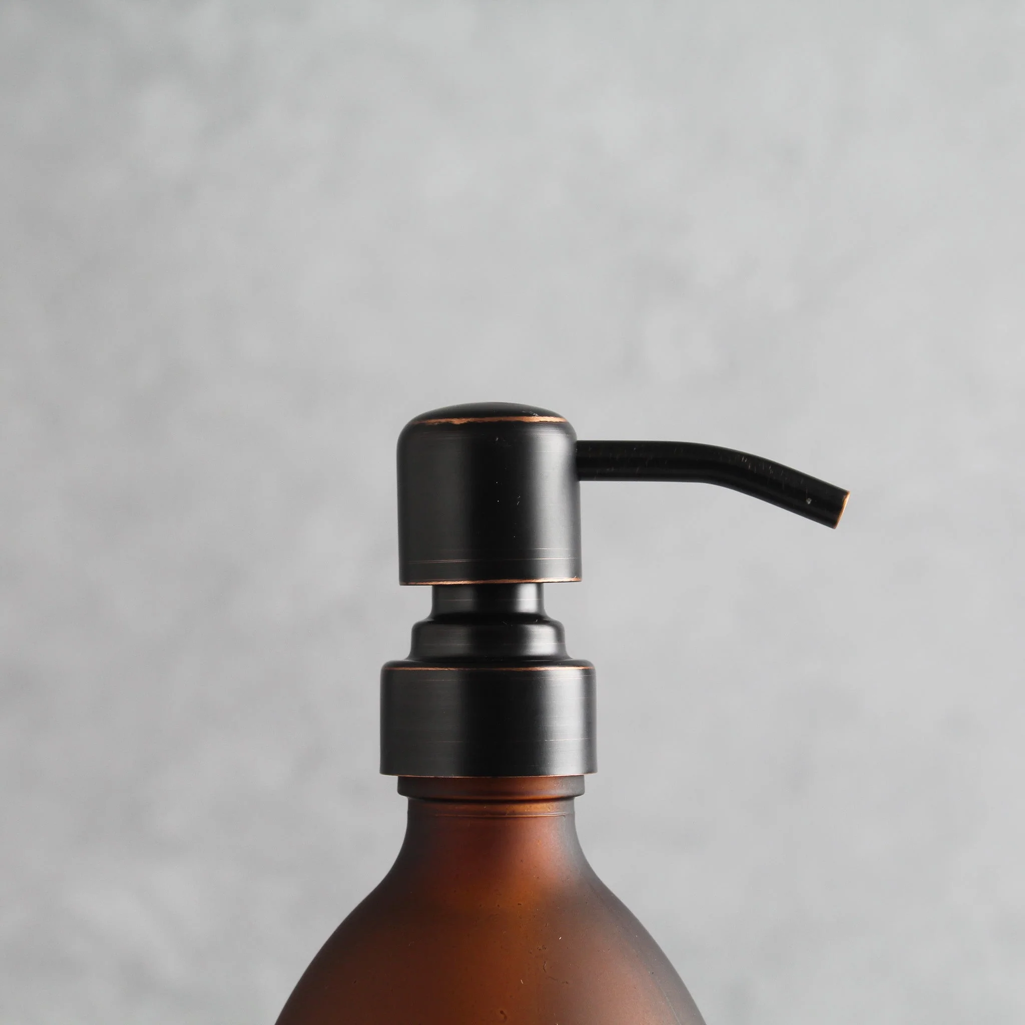 Labelled Frosted Amber Glass Dispenser Bottle With Black/Copper Pump - Image 6