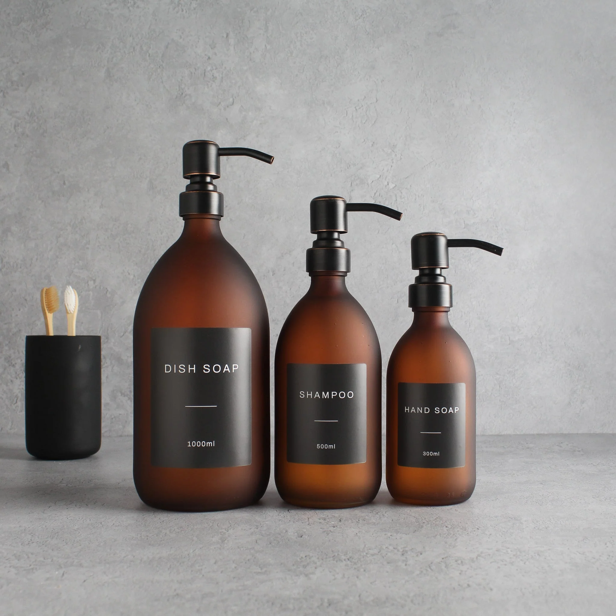 Labelled Frosted Amber Glass Dispenser Bottle With Black/Copper Pump - Image 2