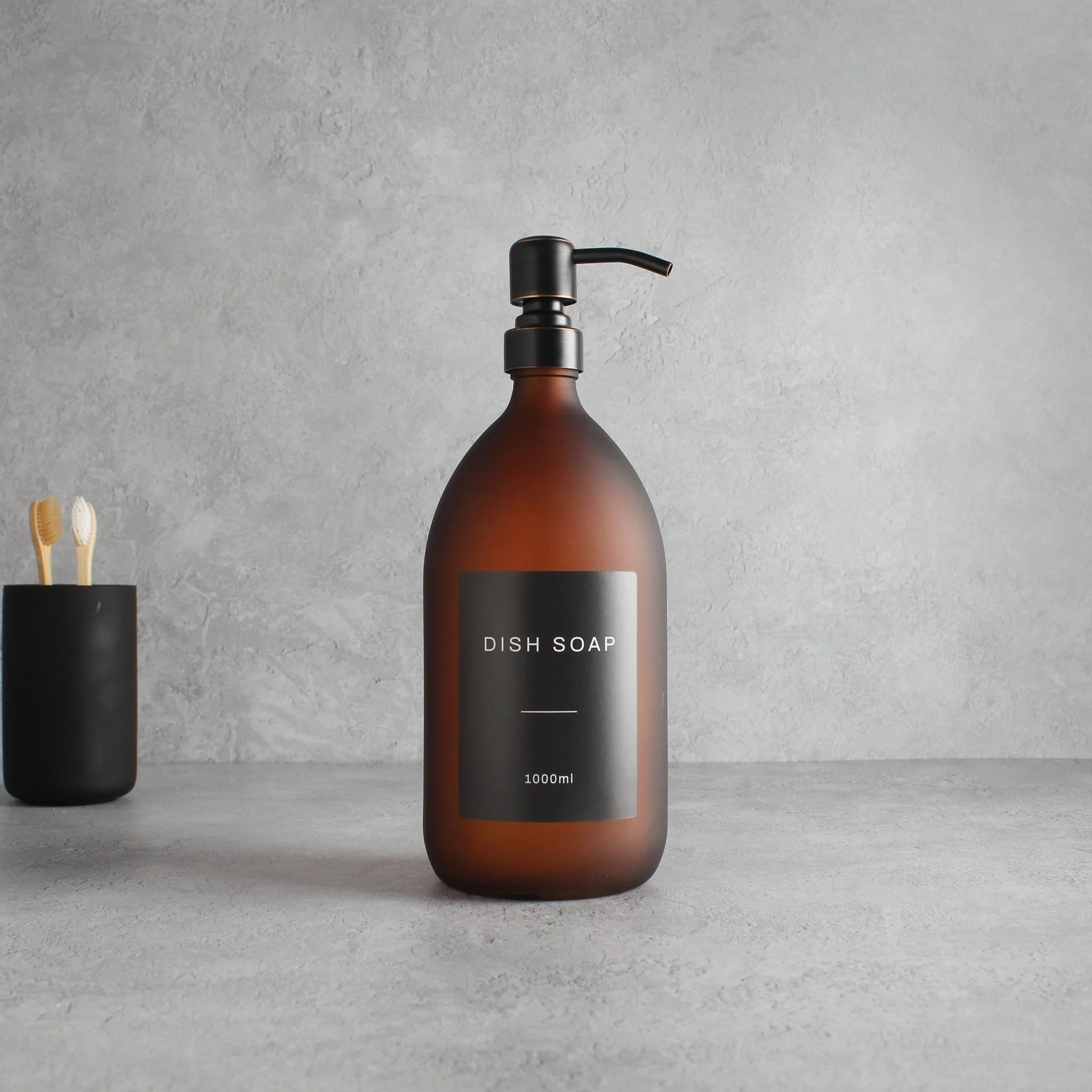 Labelled Frosted Amber Glass Dispenser Bottle With Black/Copper Pump - Image 3