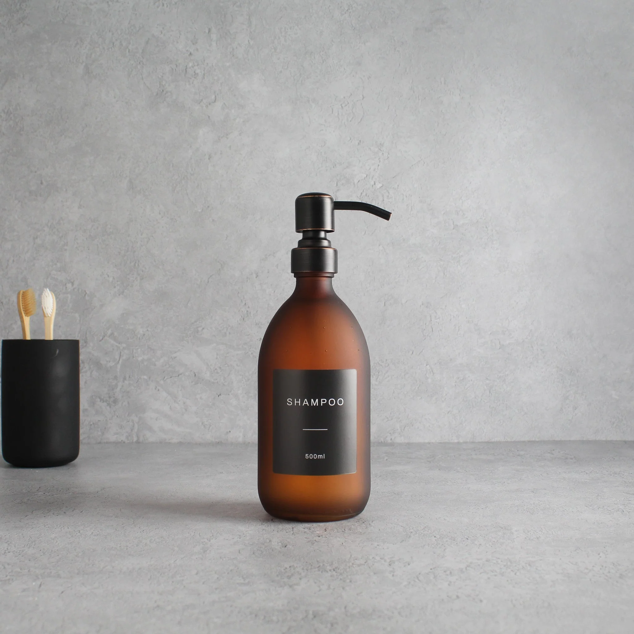 Labelled Frosted Amber Glass Dispenser Bottle With Black/Copper Pump - Image 4