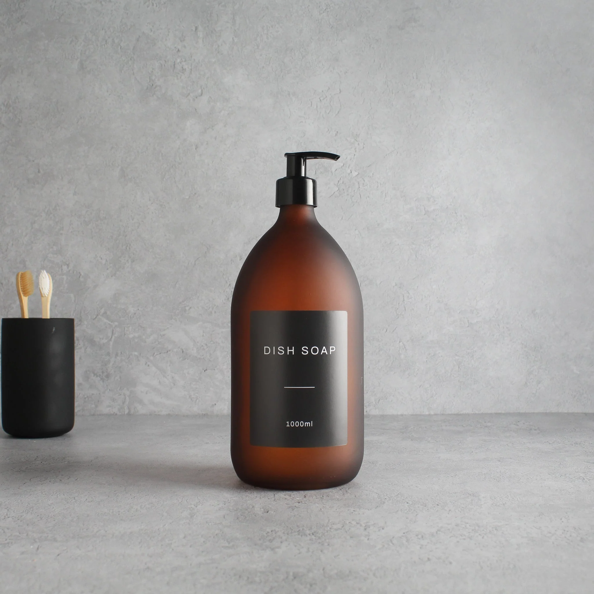 Labelled Frosted Amber Glass Dispenser Bottle With Black Pump - Image 3