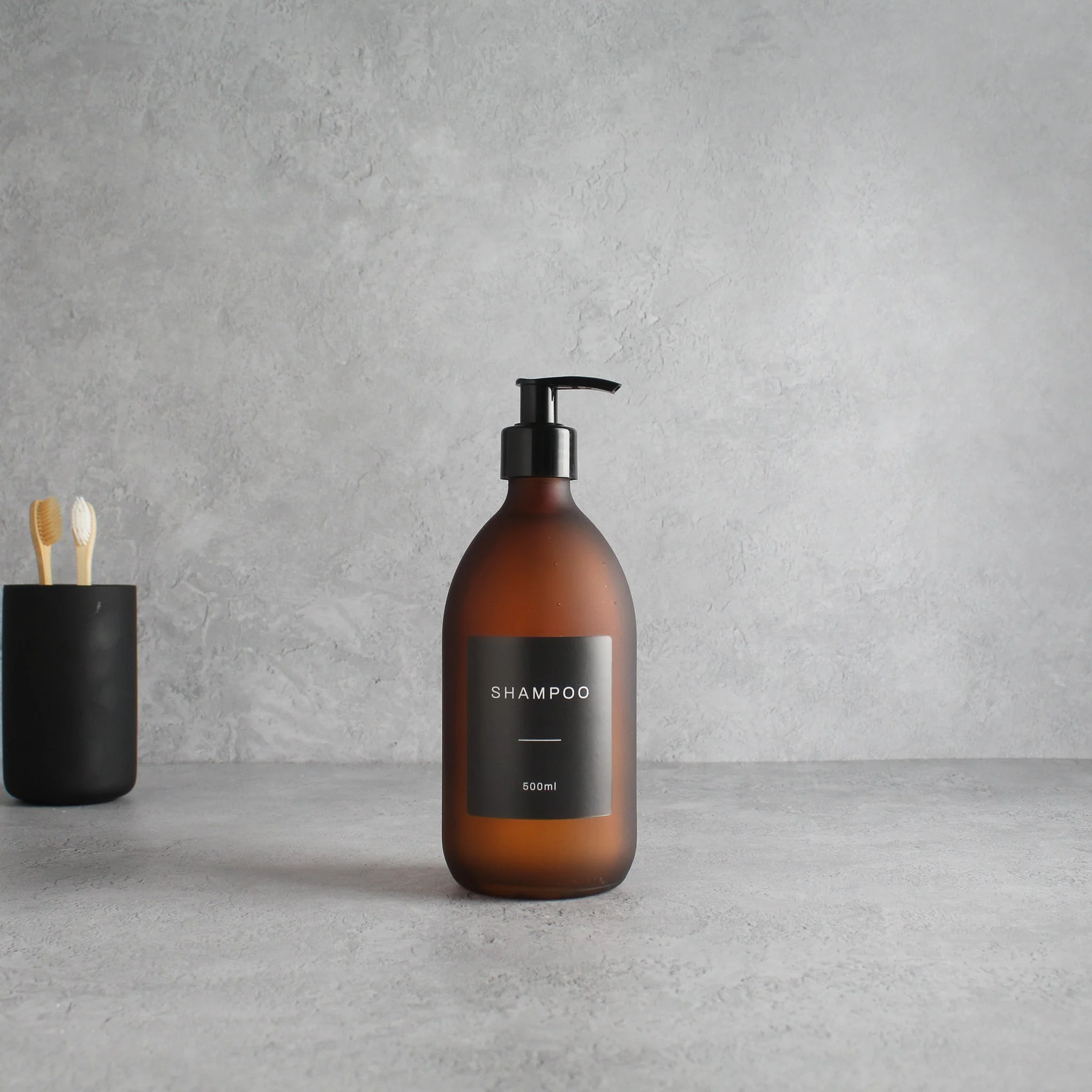 Labelled Frosted Amber Glass Dispenser Bottle With Black Pump - Image 4