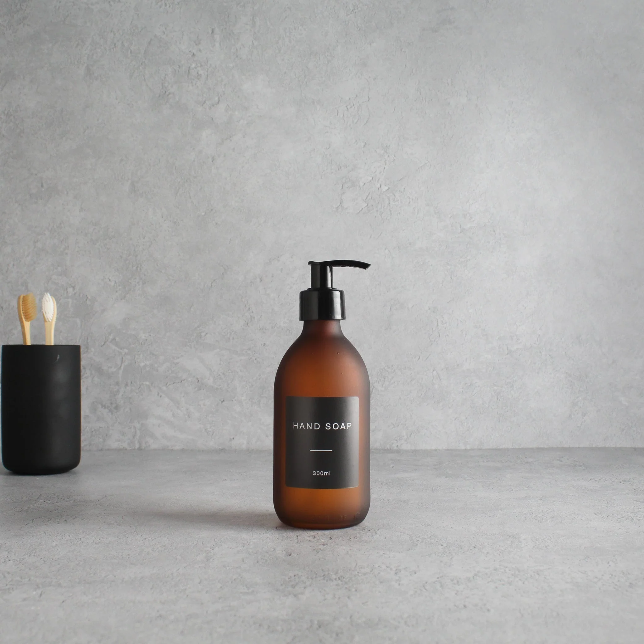 Labelled Frosted Amber Glass Dispenser Bottle With Black Pump - Image 5