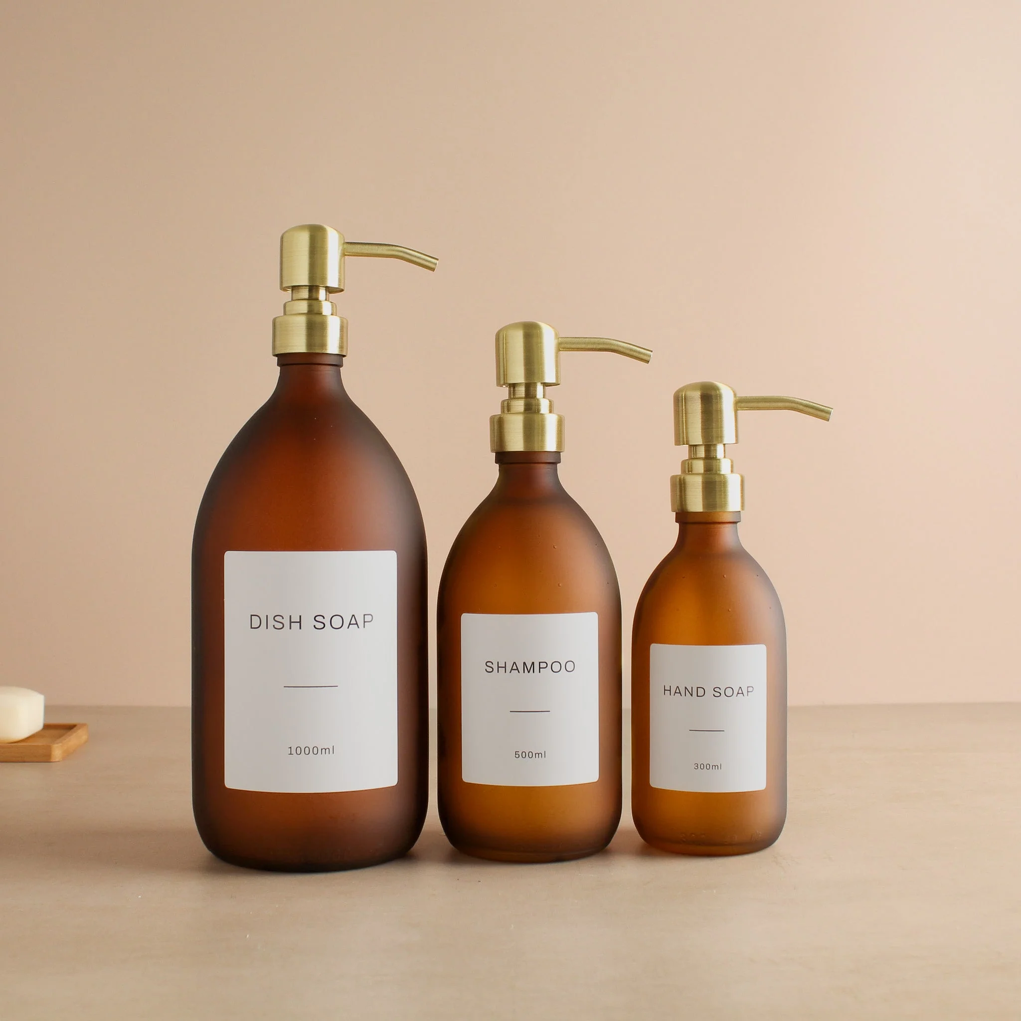 Labelled Frosted Amber Glass Dispenser Bottle With Gold Pump - Image 2