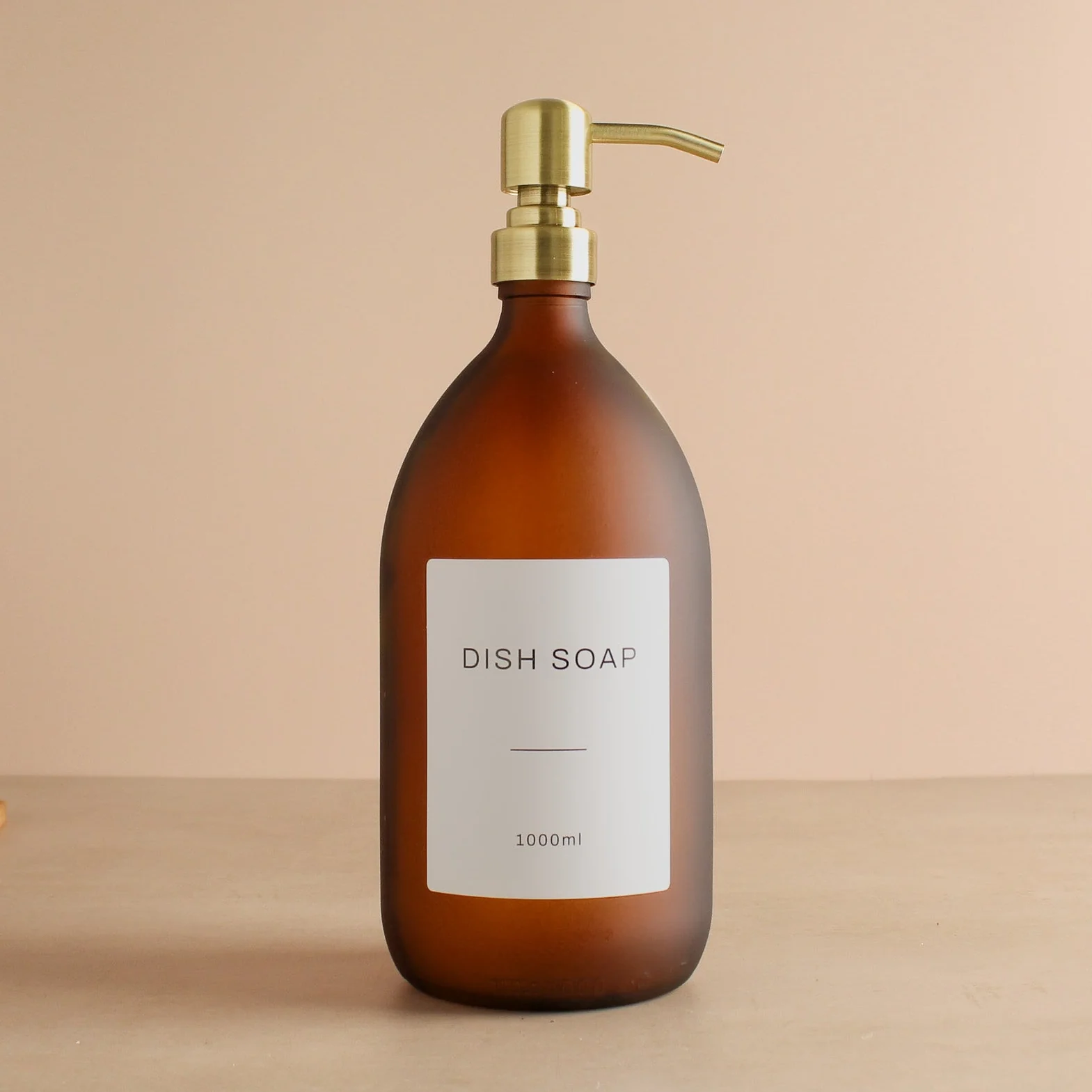 Labelled Frosted Amber Glass Dispenser Bottle With Gold Pump - Image 3